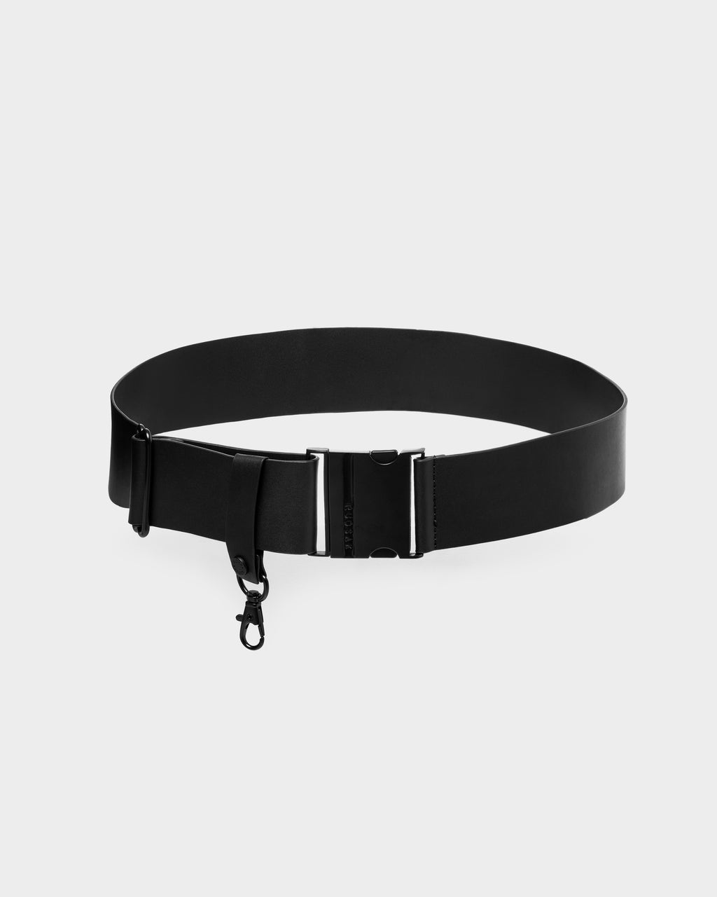 The Rudsak LOTUS - 8425002 Black is a minimalist black belt with a metal buckle and small attached hook, shown on a plain white background.