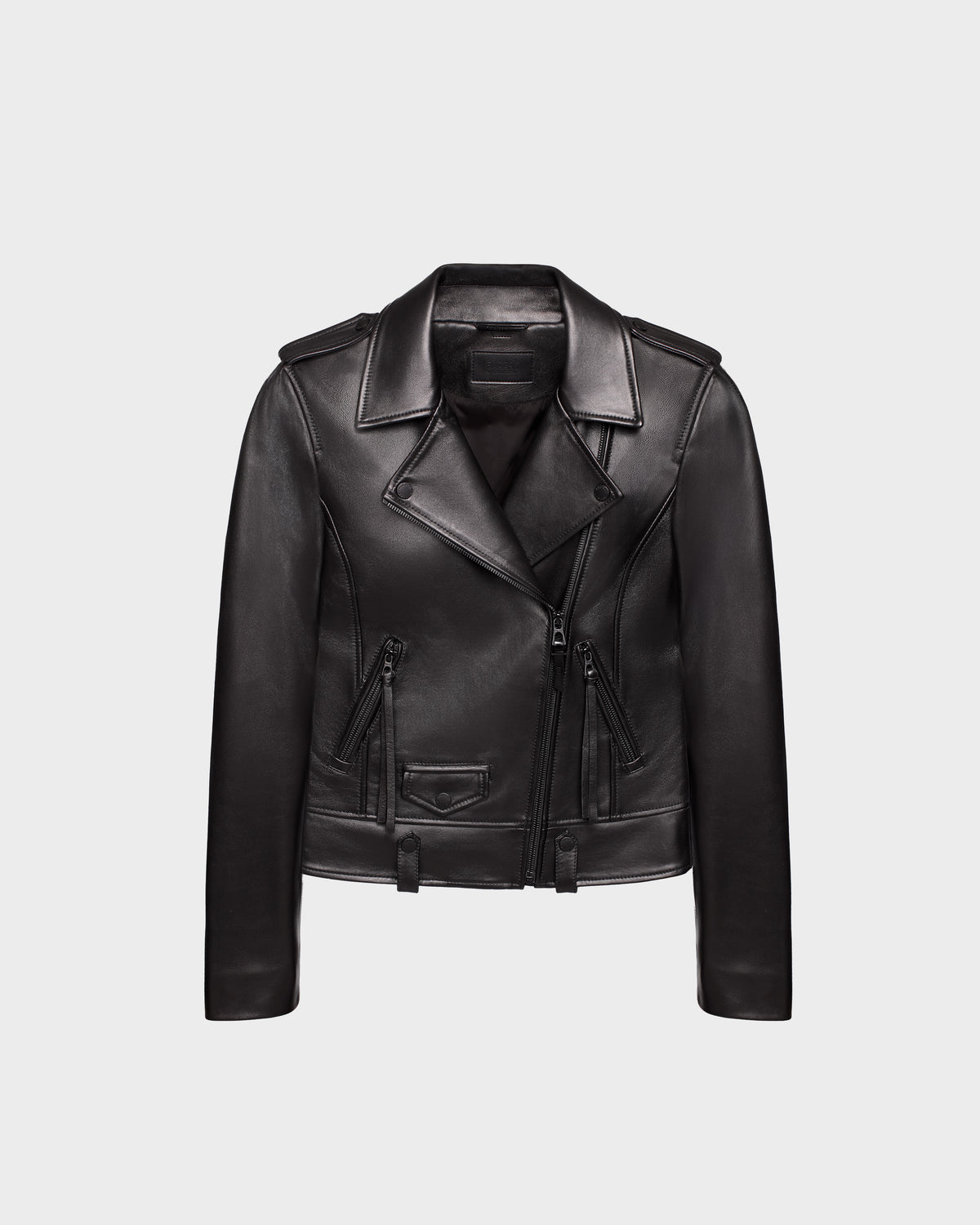 The MERGO - 8122009 BLACK by Rudsak is a women’s black lambskin leather biker jacket with a notched lapel collar, asymmetrical front zipper, and zippered pockets, shown on a plain light gray background.