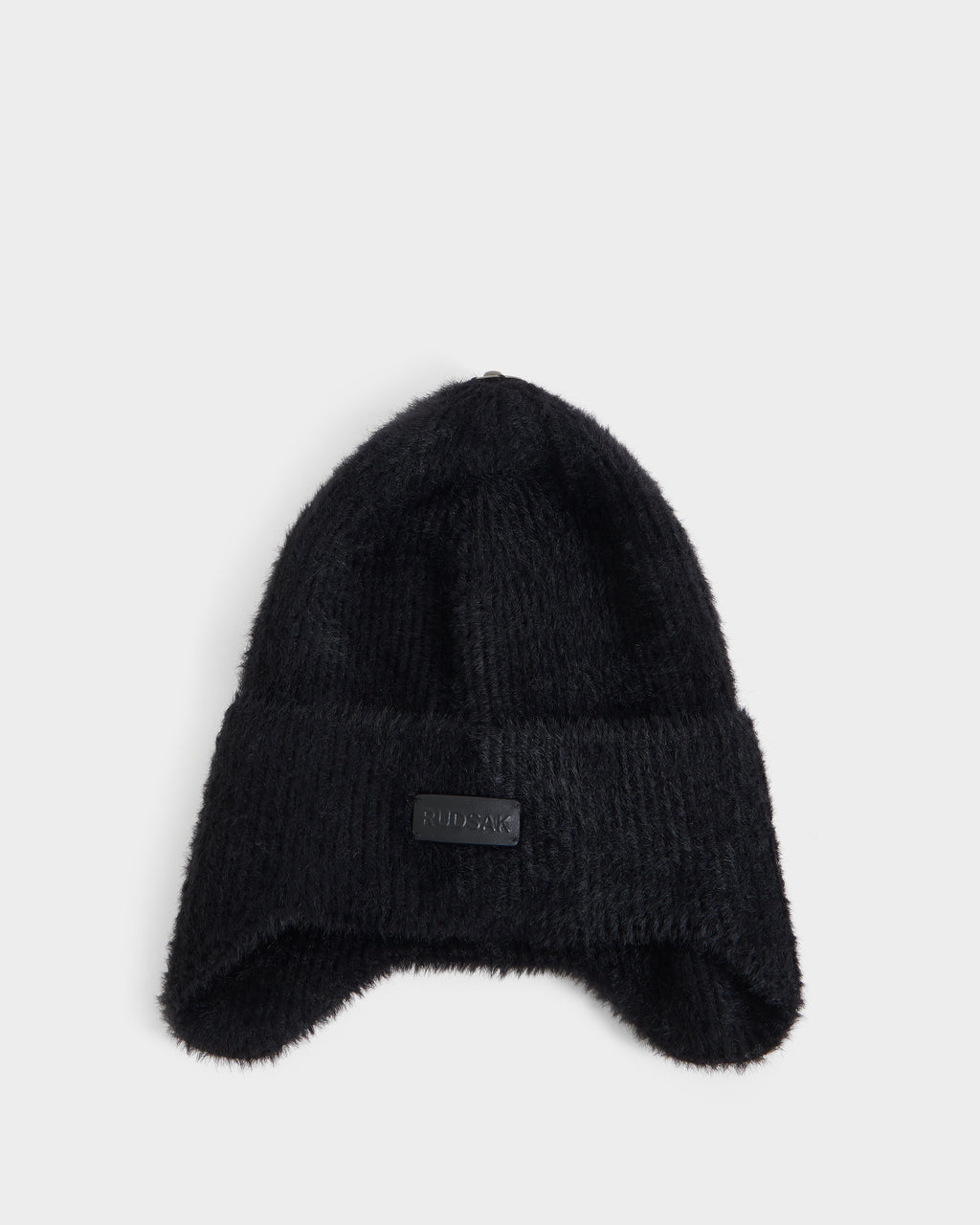 A black knit beanie from Rudsak, the ICE - 8426519 Black, featuring a folded brim and a small rectangular patch on the front, displayed against a plain white background.