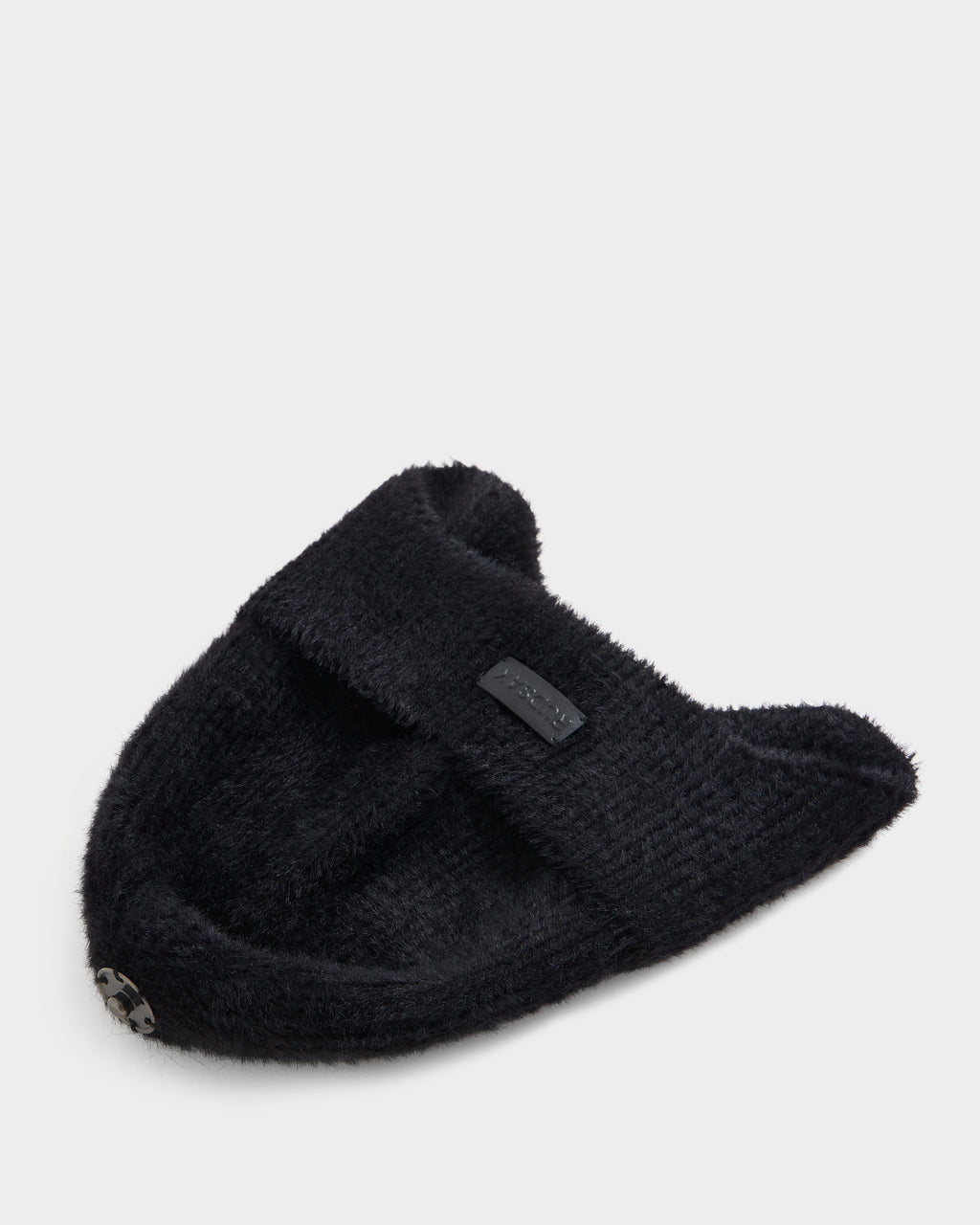 The Rudsak ICE - 8426519 Black headband is a black fuzzy knit accessory featuring two pointed ear shapes, a small metal logo on one side, and a black tag sewn on the front, shown against a light gray background.