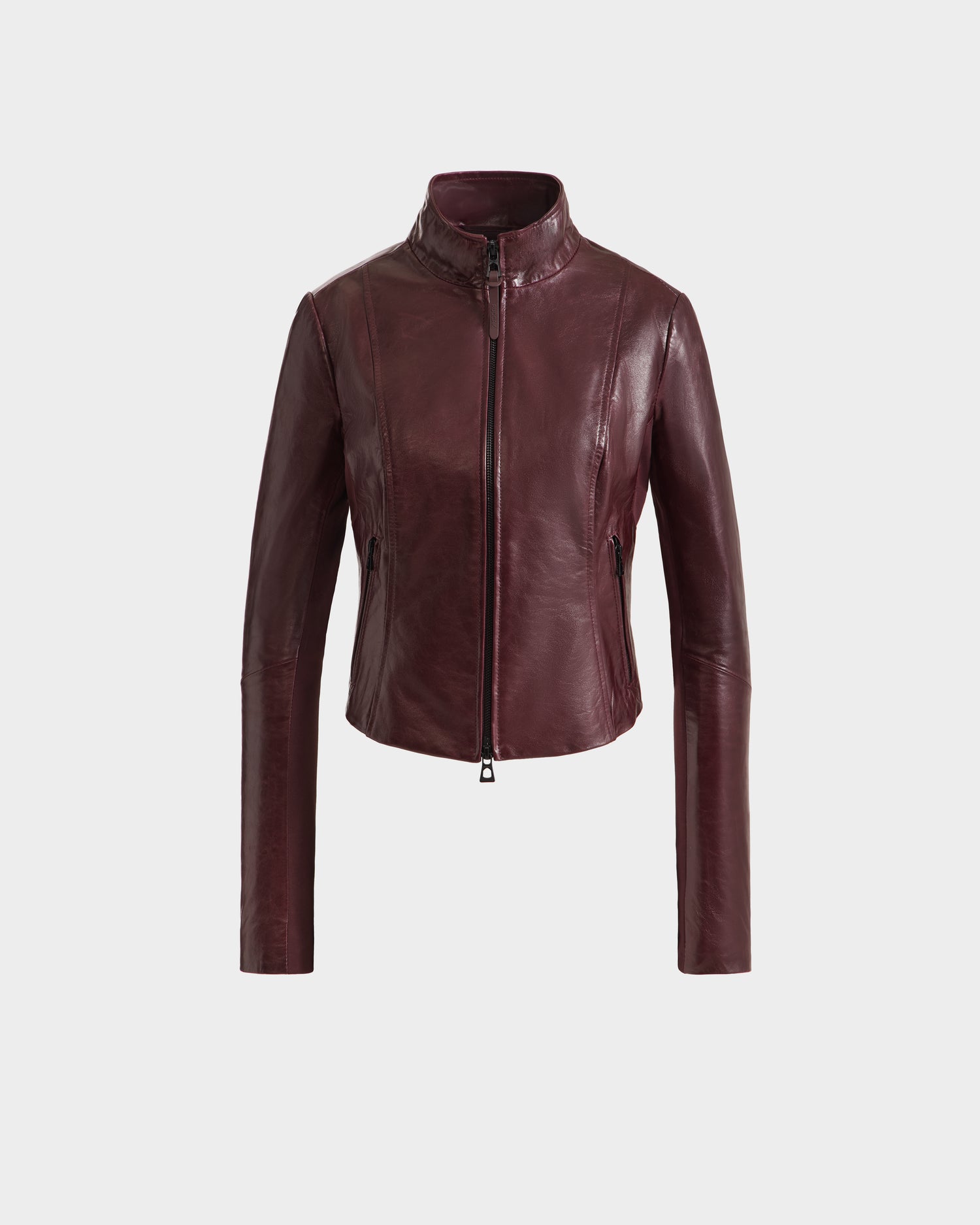 The Rudsak ABIGAIL - 8124560 Bordeaux womens fitted leather racer jacket features a front zipper, high collar, and long sleeves, shown against a plain white background.