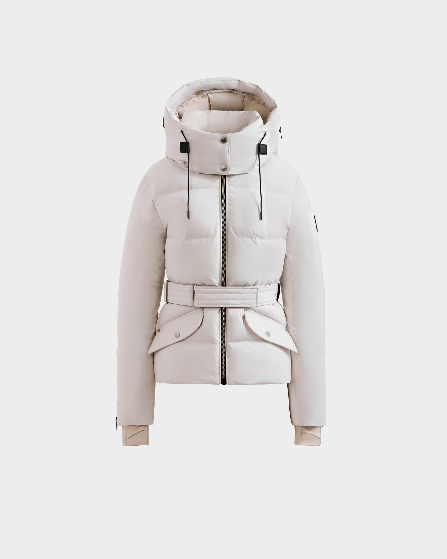 The Rudsak ADELINE H - 8125587 Vanilla is a women's white down puffer jacket with a hood, black zipper details, flap pockets, and adjustable cuffs, shown on a plain light gray background.