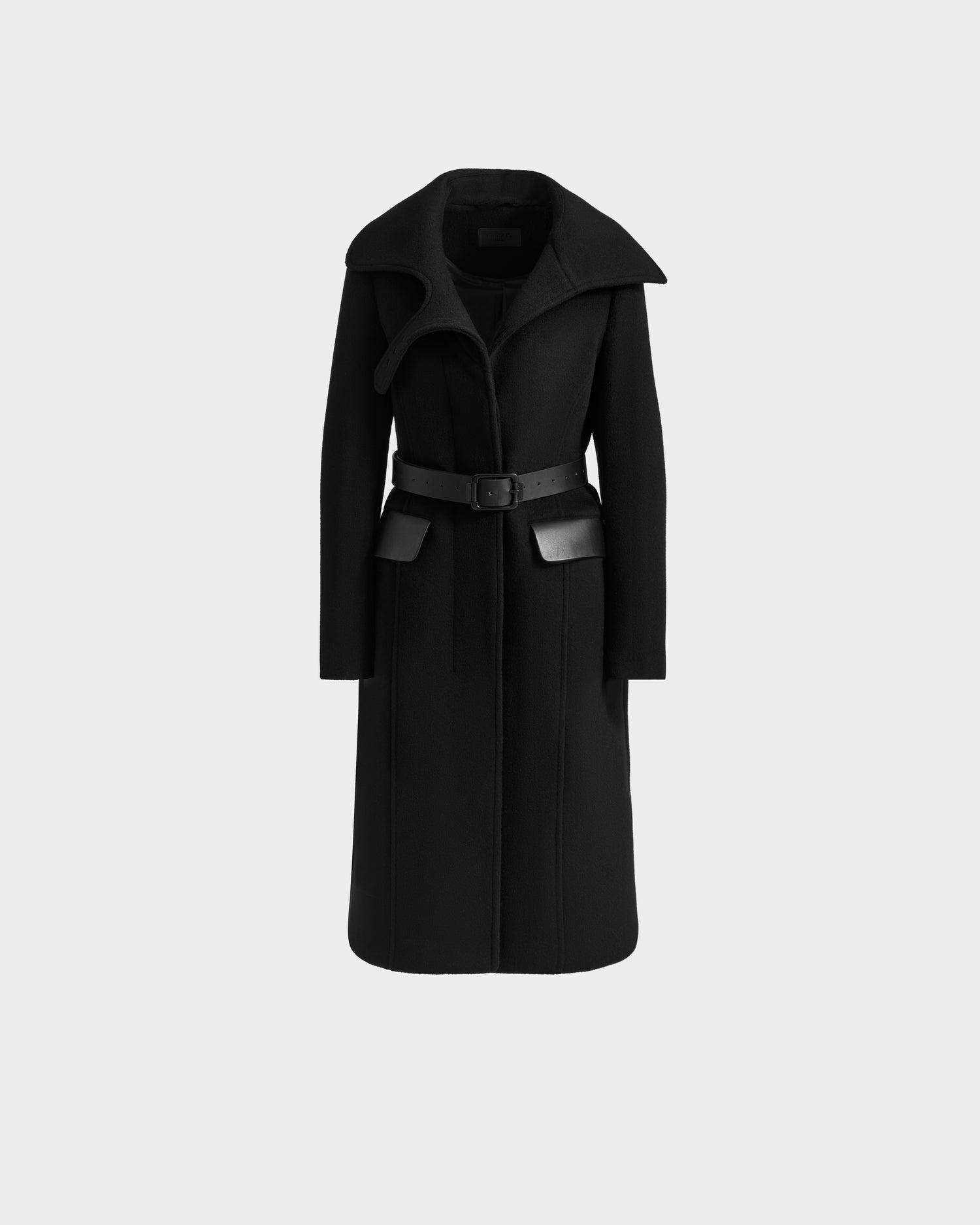 The ALICE - 8125606 Black by Rudsak is a womens long black wool coat with a large collar, belted waist, and leather accents on the belt and pockets, shown against a plain light gray background.