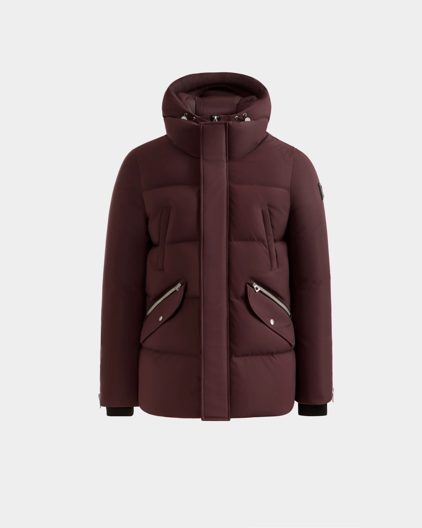 The APOLLO H - 6125690 Bordeaux by Rudsak is a maroon men's quilted down parka with a hood, front zipper with flap, two diagonal zippered pockets with metal details, and ribbed black cuffs for a stylish winter look.