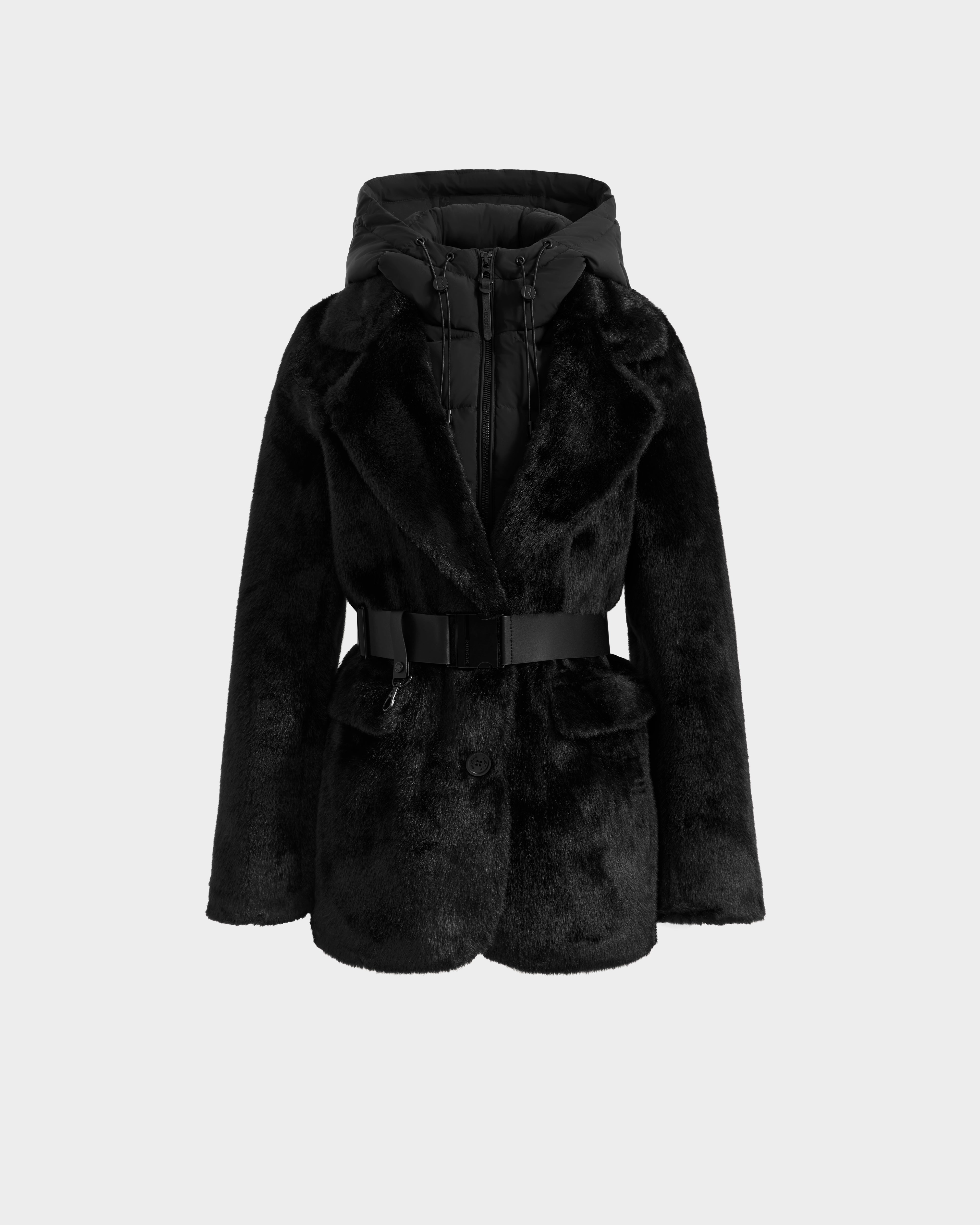 The Rudsak ASPEN F - 8125604 Black women's faux fur jacket features a wide collar, removable hooded dickie, belted waist, button closure, and quilted inner layer—perfect for cold weather. Shown on a plain light gray background.