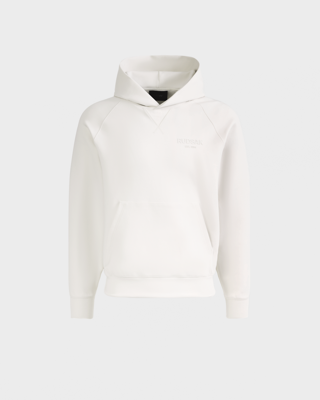 The Rudsak BARRY - 9524011 Vanilla M is a plain white unisex hoodie with long sleeves, a front kangaroo pocket, and subtle embossed chest text, shown on a light grey background.