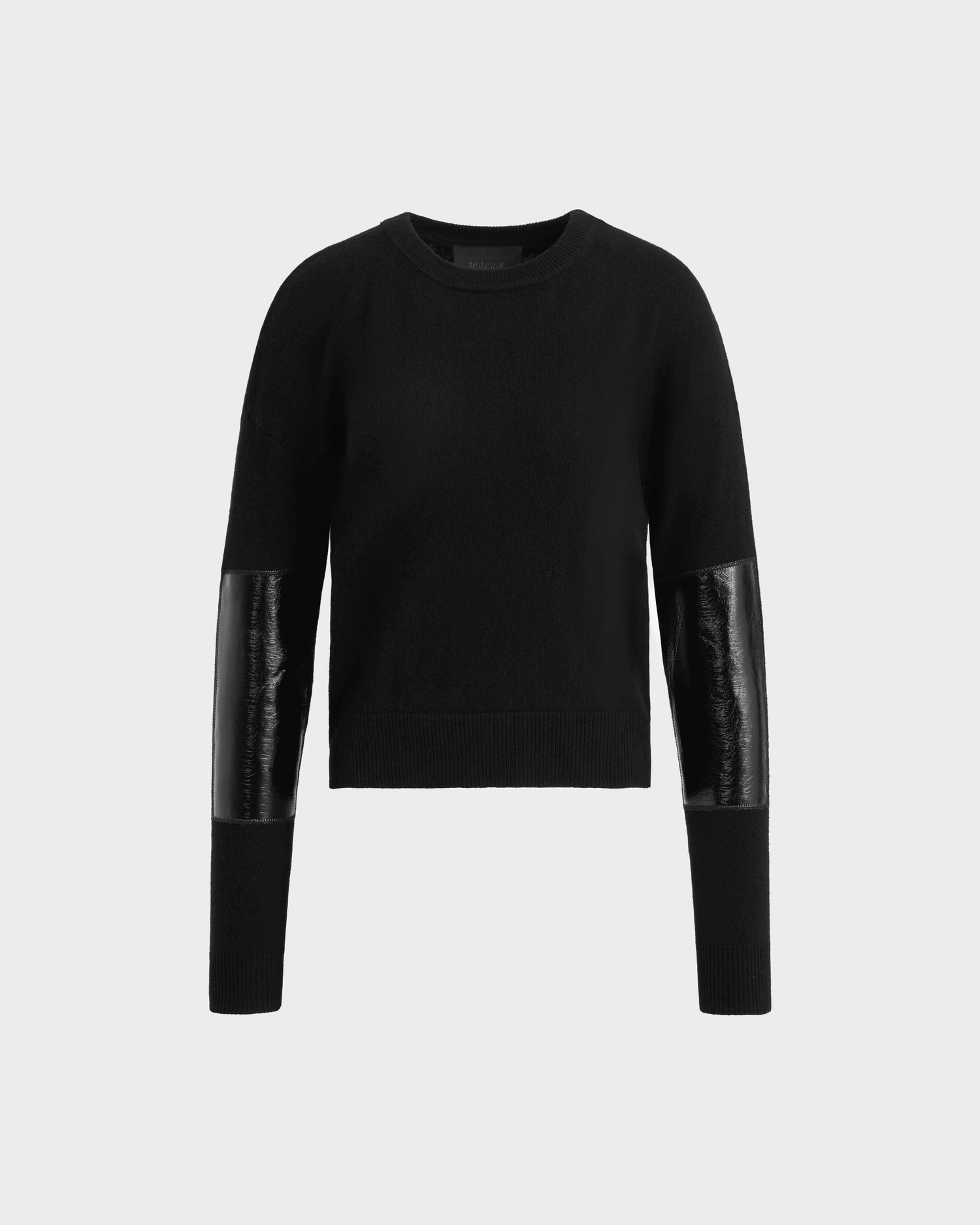 The Rudsak BELLEROSE - 8525554 Black is a womens wool crewneck sweater with shiny leather-like patches on the lower sleeves, perfect for fall and winter, shown against a plain white background.