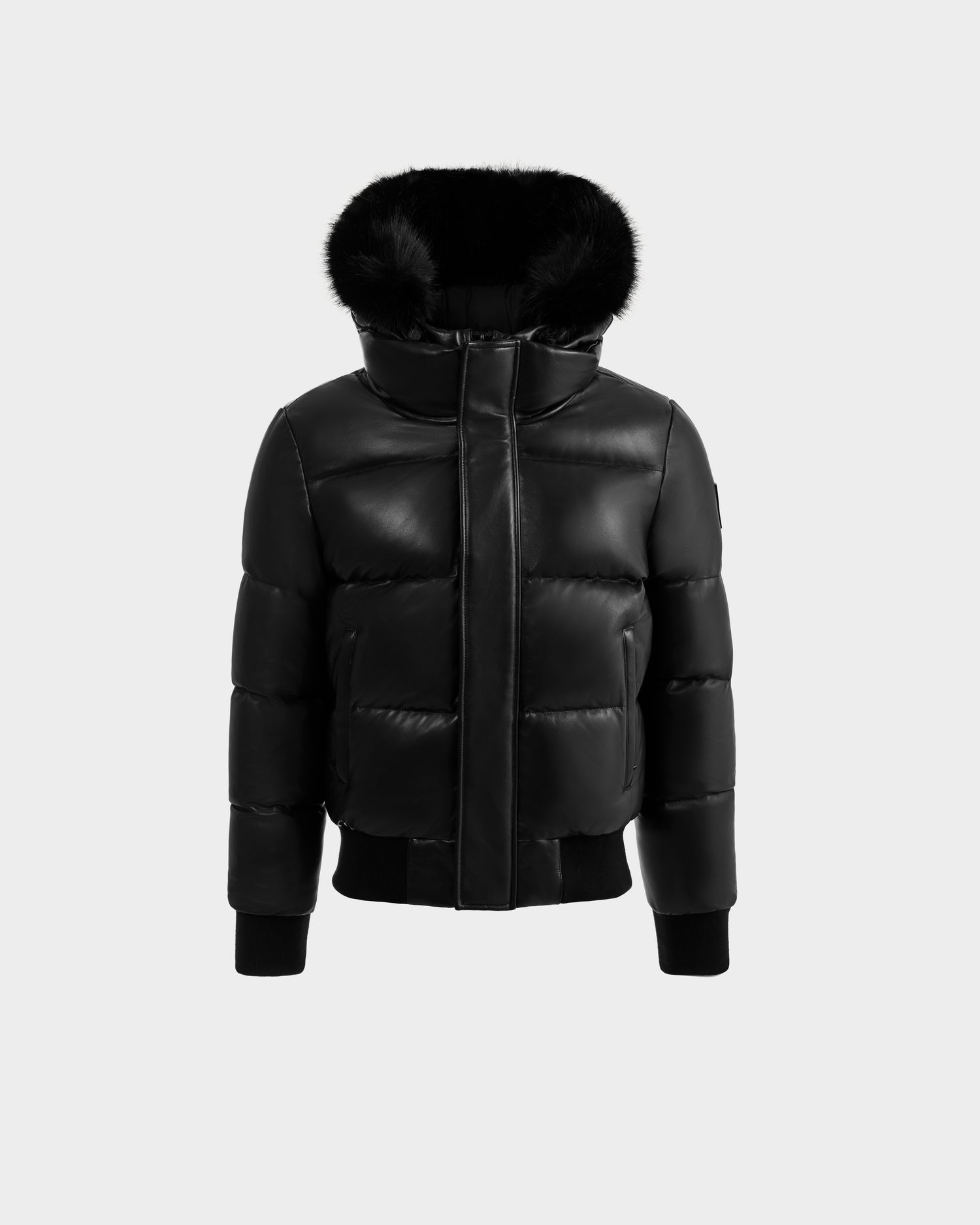 The RUDSAK BOND X - 6122525 BLACK is a black hooded puffer jacket with RDS-certified down, faux fur trim, front zipper, and ribbed cuffs and hem, shown on a plain light gray background.
