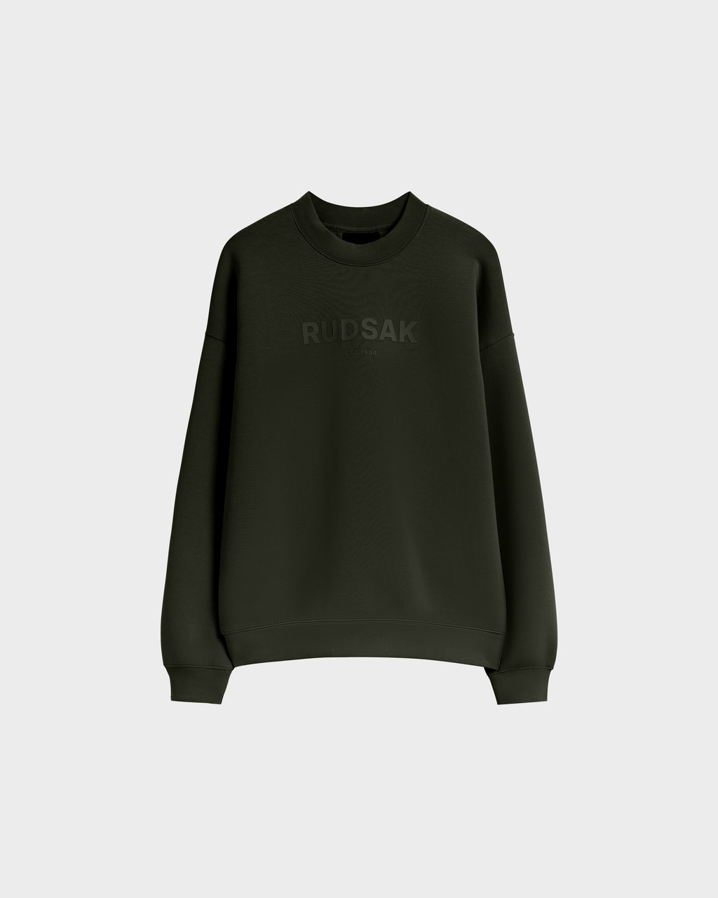 The BRYN - 9524007 Dark Olive W by Rudsak is a dark green cotton crewneck sweatshirt with long sleeves, featuring a subtle Rudsak chest print and genderless sizing. Shown on a plain light grey background.