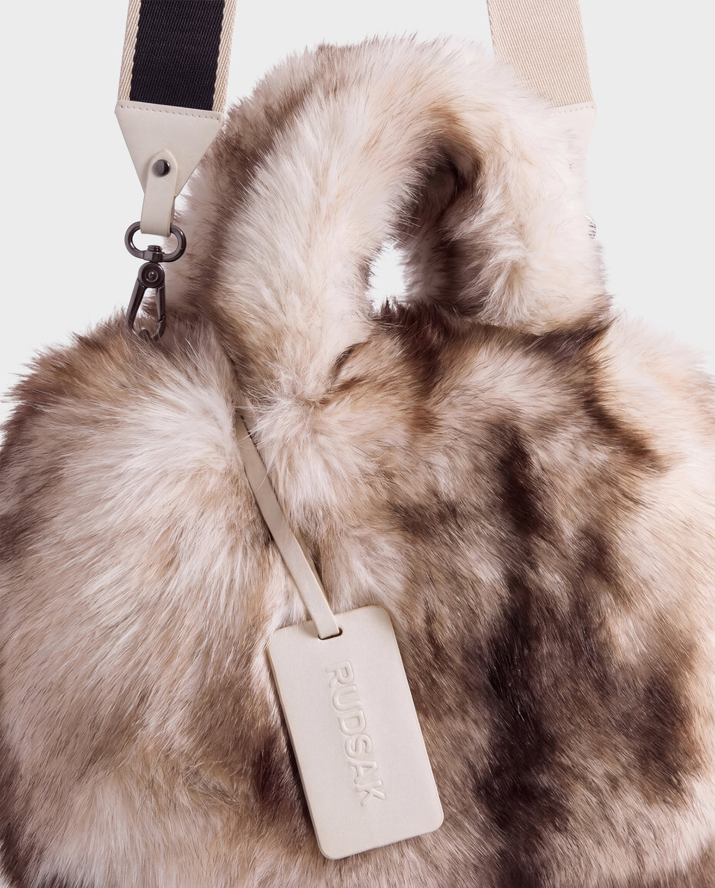Rudsak CABAS - 8325545 Mix Vanilla faux fur mini tote featuring two top handles, a beige and black shoulder strap, and a branded luggage tag.