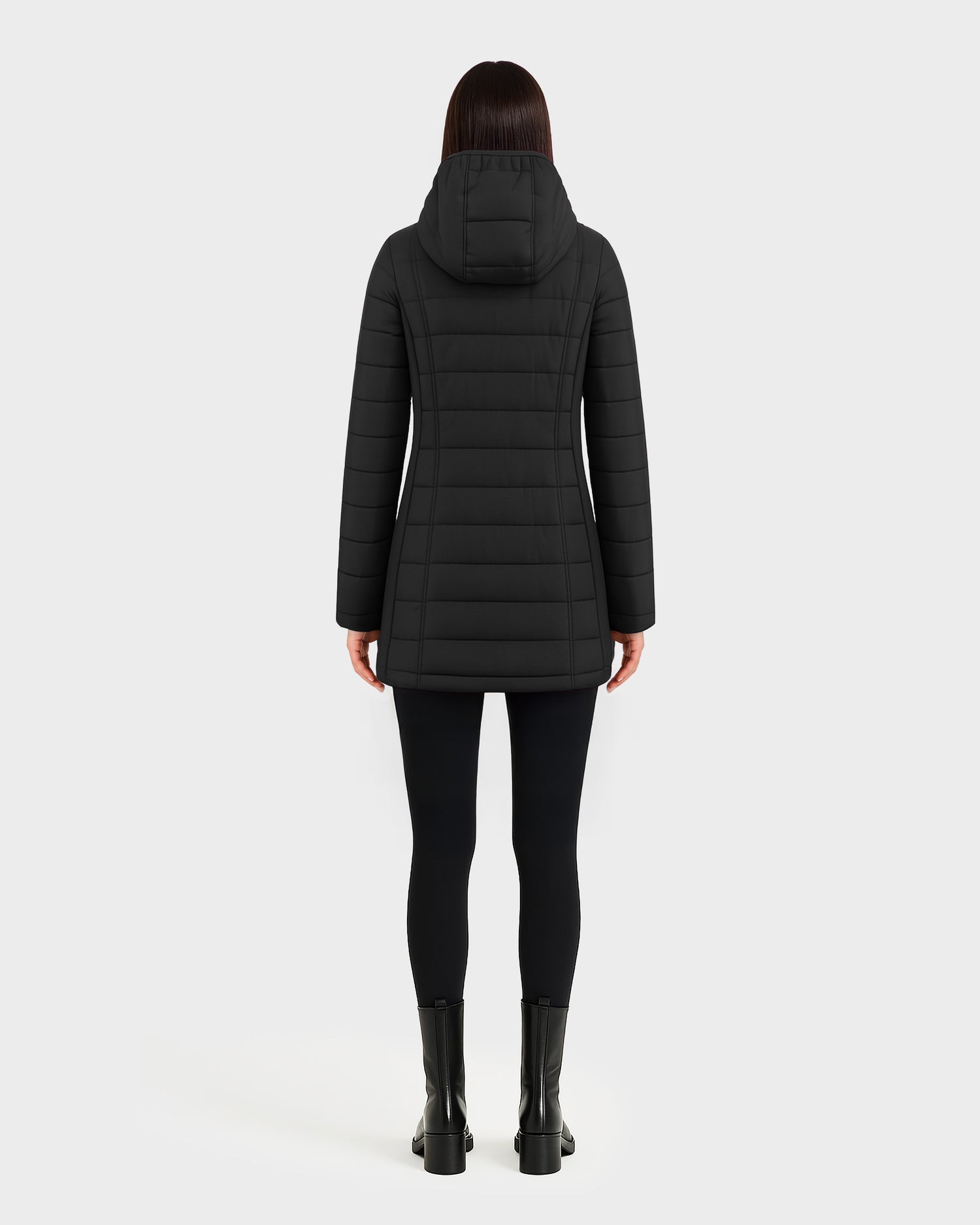 Viewed from behind against a white background, a person with straight dark hair is wearing Rudsak's CORDELIA - 4124519 Black water-repellent down puffer coat, paired with black leggings and black ankle boots.