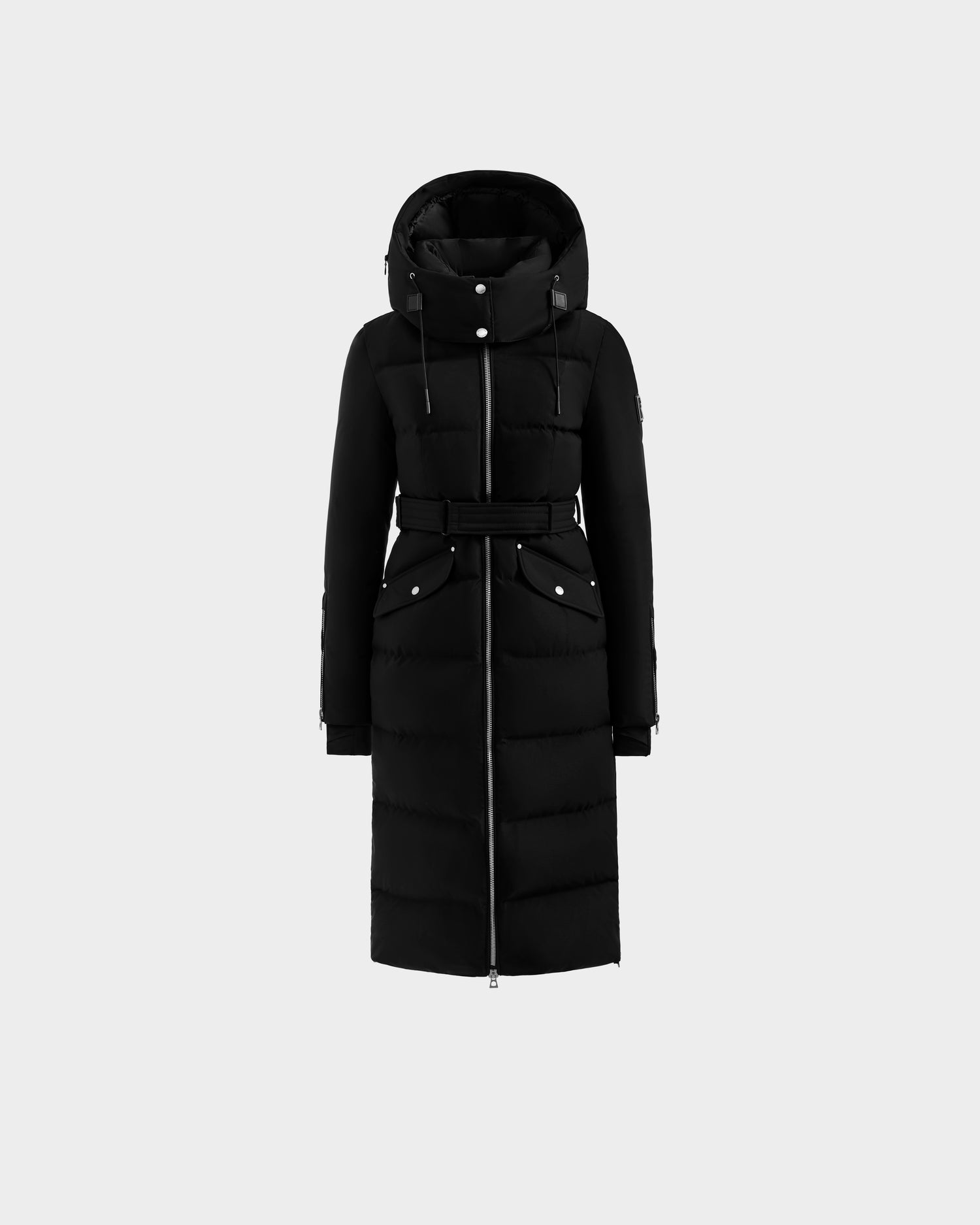 The Rudsak CALI H - 8125614 Black women’s down parka features a removable hood, front zipper, belted waist, and two button-flap pockets, shown against a plain light background.