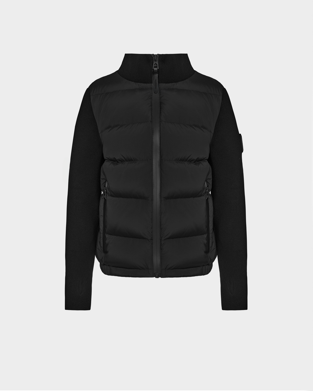 The Rudsak CAMILLE HV - H125500 Black is a limited-edition puffer jacket featuring a high collar, front zipper, zippered side pockets, and fitted sleeves and sides contrasting with the quilted front and back.