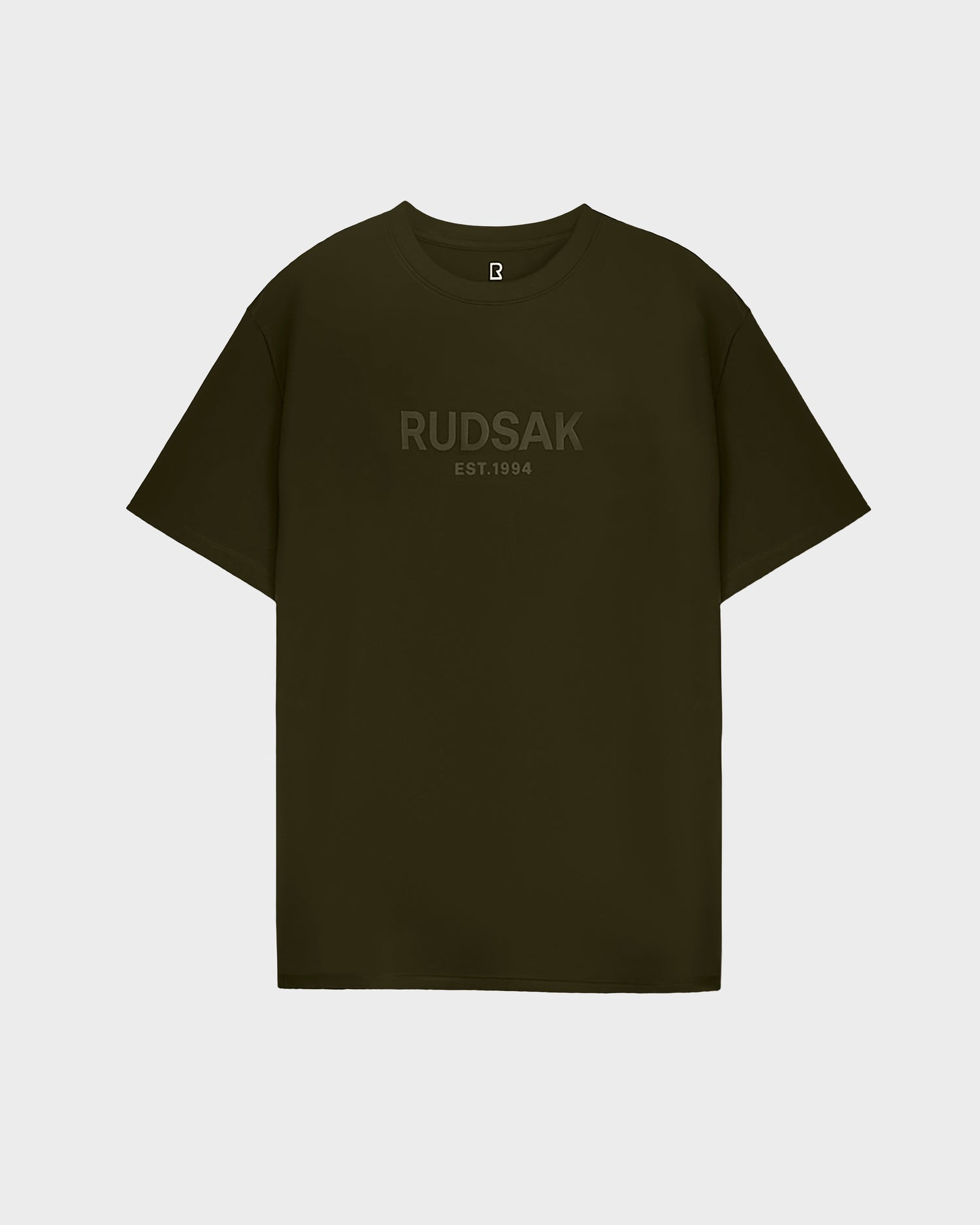 The Rudsak CASEY - 6525037 mens T-shirt in dark olive features RUDSAK EST. 1994 subtly printed across the chest in tonal lettering, showcased against a light gray background.