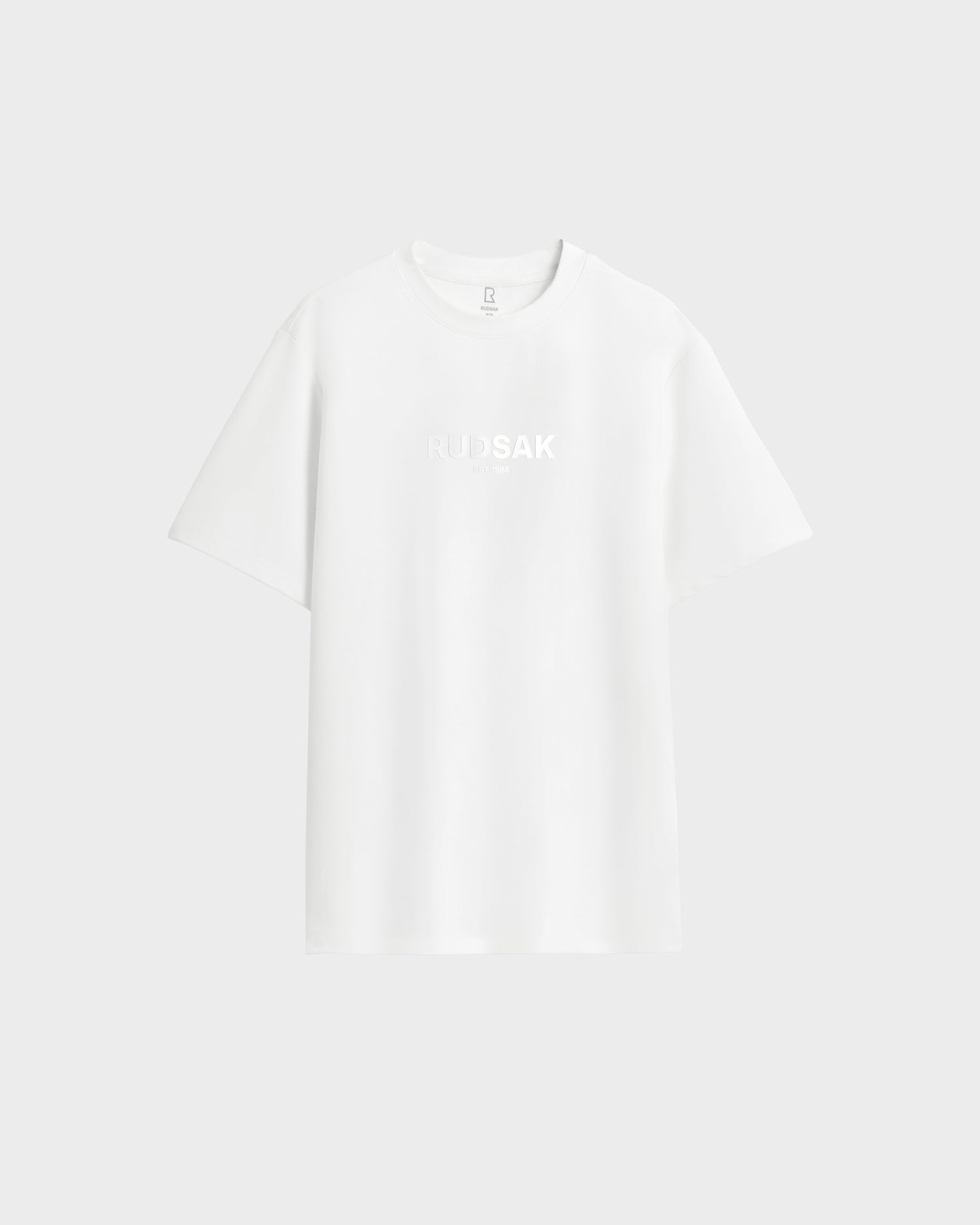 The Rudsak CASEY - 6525037 Optic White mens T-shirt is a comfortable essential featuring the word RUDSAK subtly printed in white on the chest, set against an optic white background.