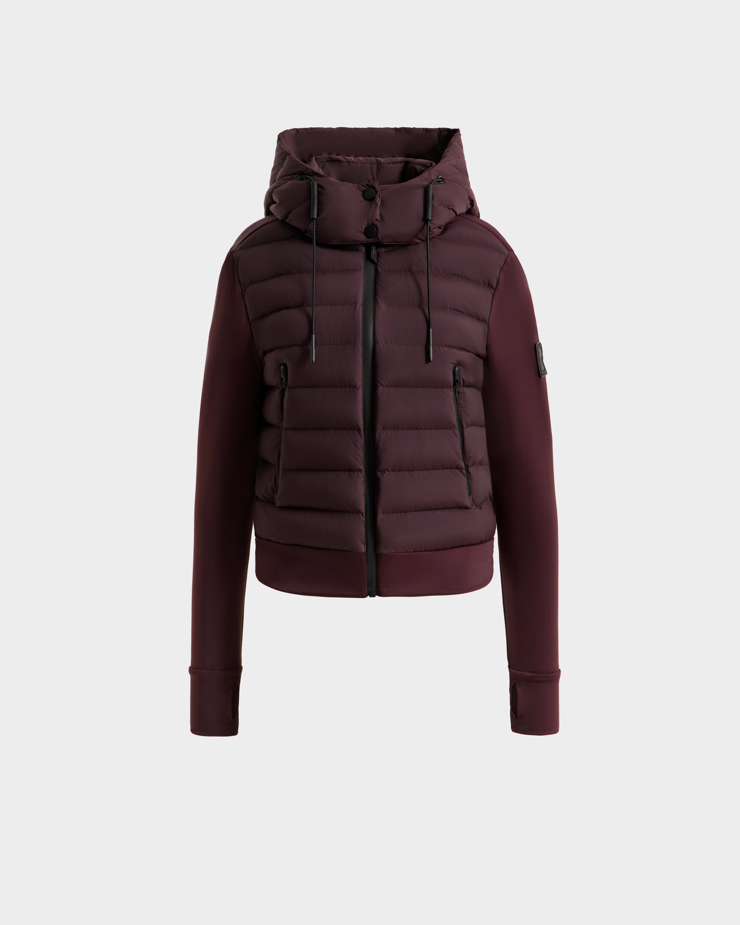 The Rudsak CASSA - 8125057 Bordeaux is a maroon women's transitional jacket with a hood, front zipper, and black drawstrings. Featuring horizontal quilting and ribbed cuffs, this lightweight cropped jacket is shown against a white background.