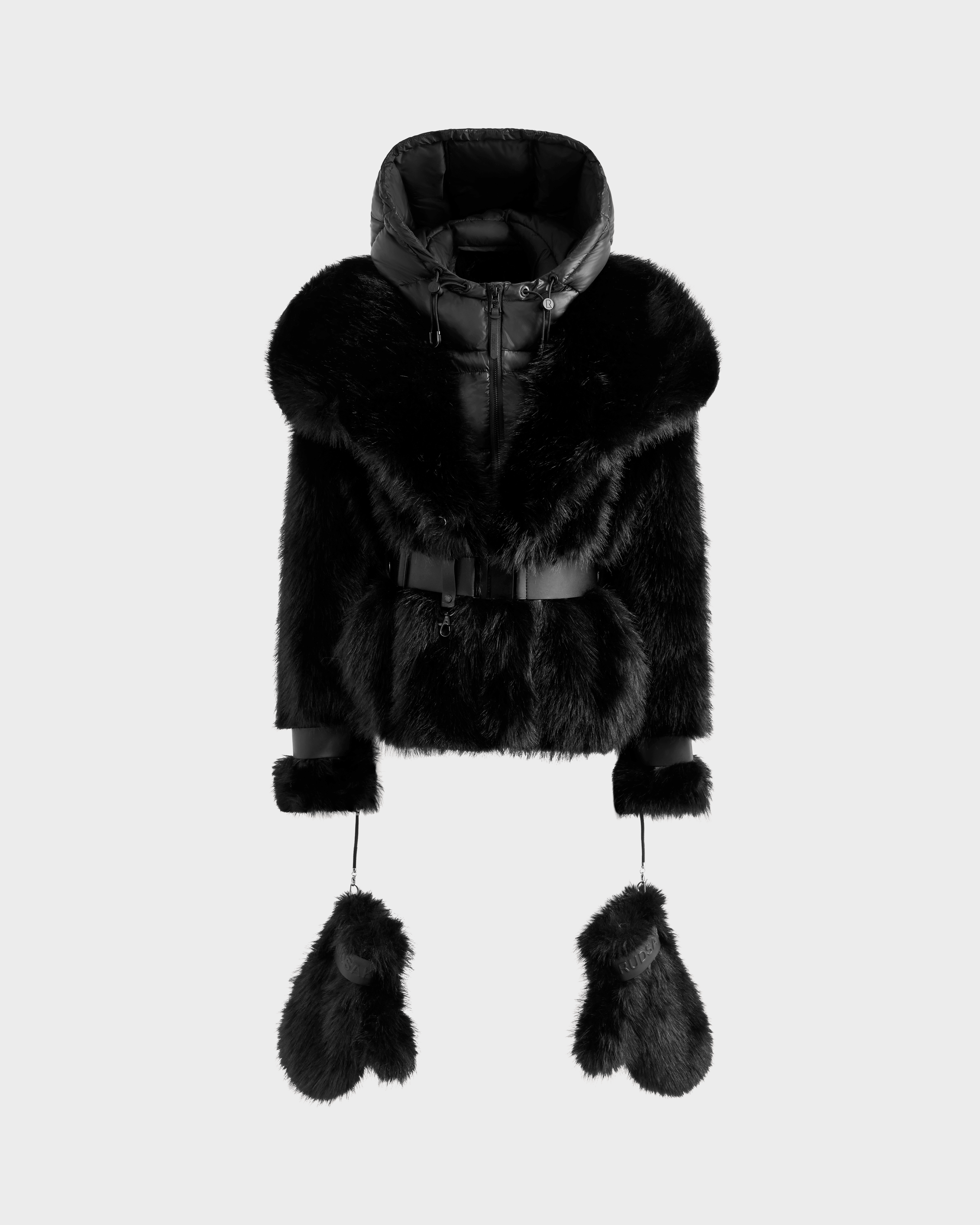 The CHLOE - 8125619 Black by Rudsak is a women's black faux fur jacket with a hood, belted waist, and matching fur mittens attached by cords—an elegant winter staple, shown on a plain light background.