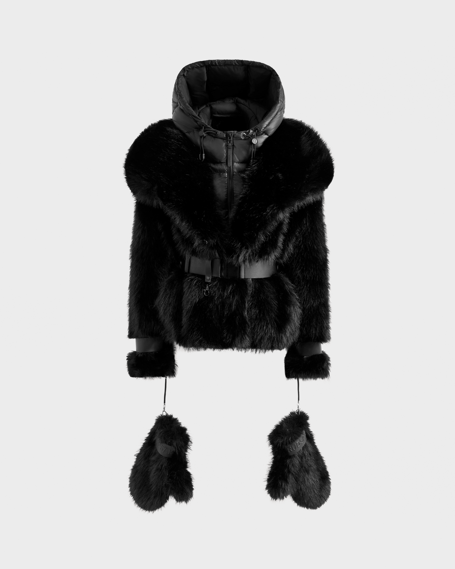 The CHLOE - 8125619 Black by Rudsak is a women's black faux fur jacket with a hood, belted waist, and matching fur mittens attached by cords—an elegant winter staple, shown on a plain light background.