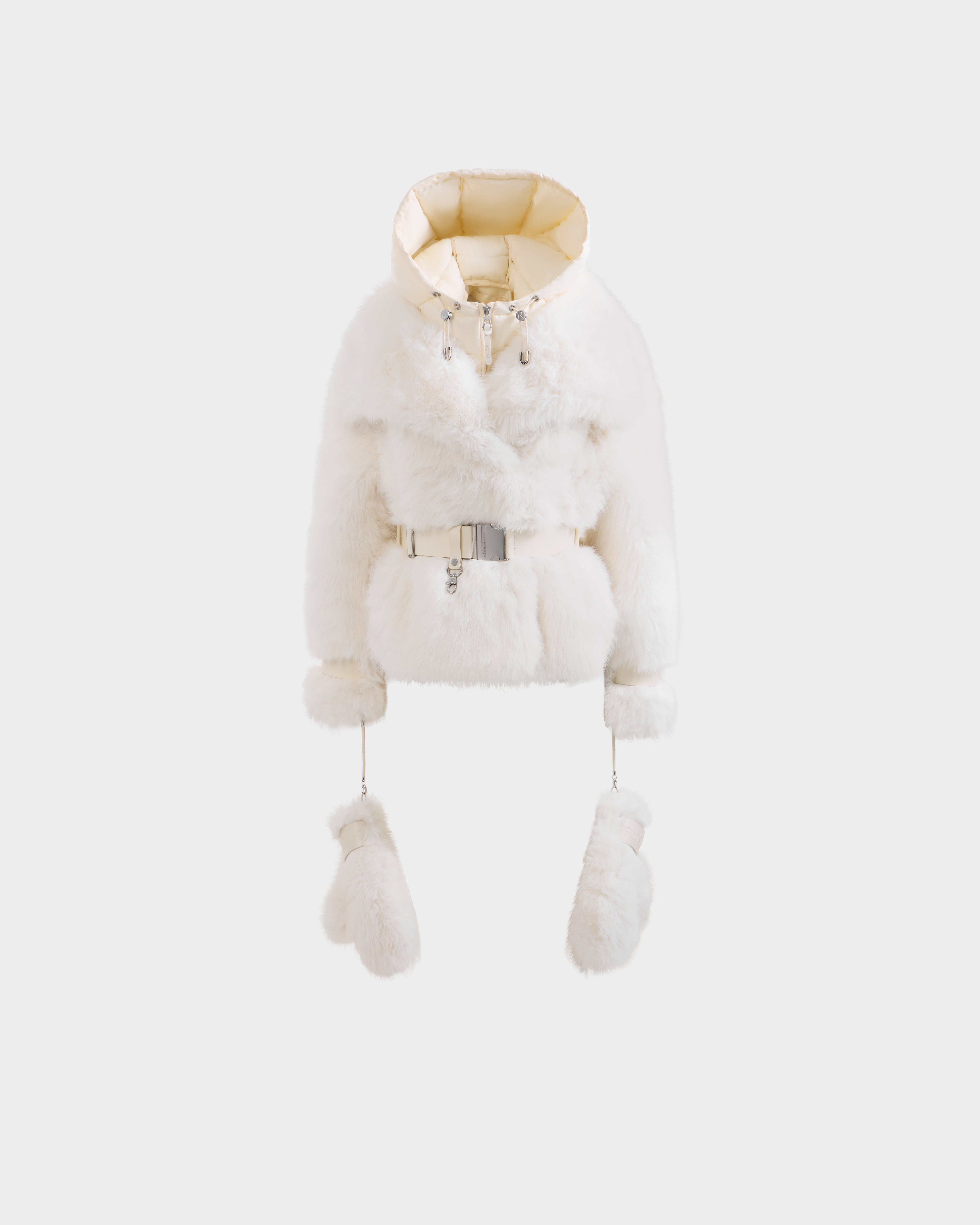 The CHLOE - 8125619 Iceland by Rudsak is a white women's faux fur jacket with a cropped fit, satin-lined hood, front zipper, adjustable belt, and matching fur mittens attached by strings—displayed against a plain light background.