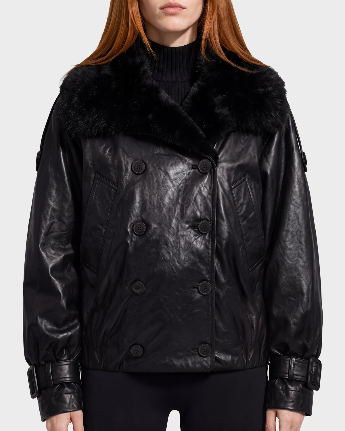 Rudsak JANELLE - 8126936 Black leather bomber featuring a faux fur collar, modern silhouette, button closures, and a double-breasted design.
