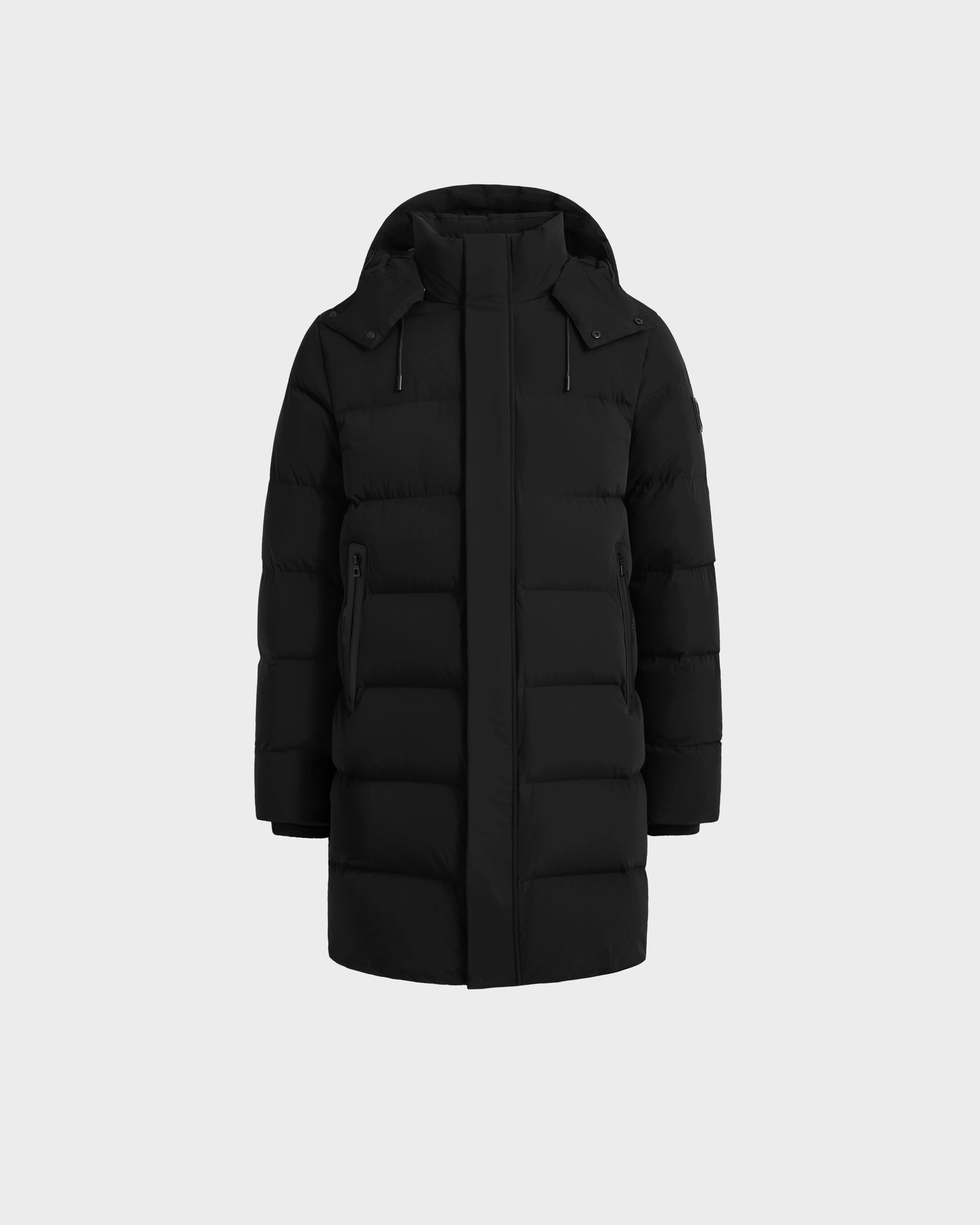 The Rudsak DAO - 6124604 Black men’s mid-length puffer parka features a weather-resistant shell, hood, long sleeves, front zipper, two zippered side pockets, and horizontal quilting. Shown on a plain light gray background.