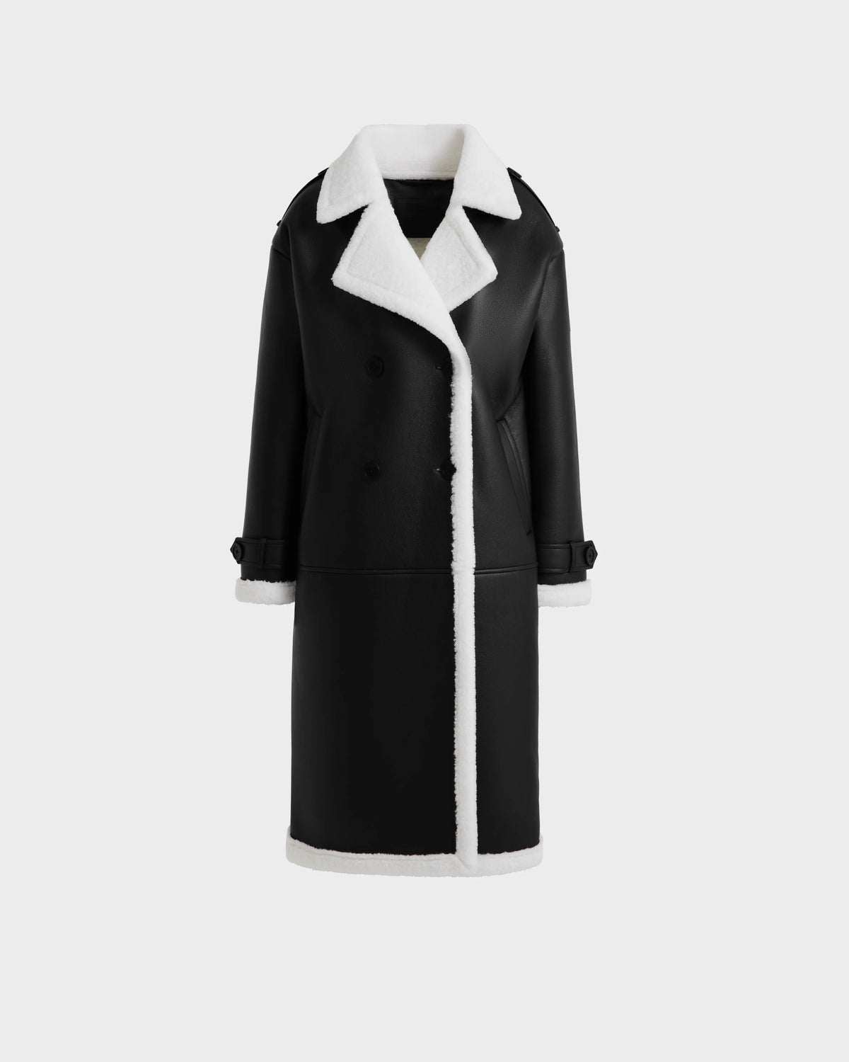 The Rudsak DARCY - L125539 Black is a double-breasted women's winter coat with white faux sherpa trim on the collar, cuffs, and hem, shown against a plain light grey background.