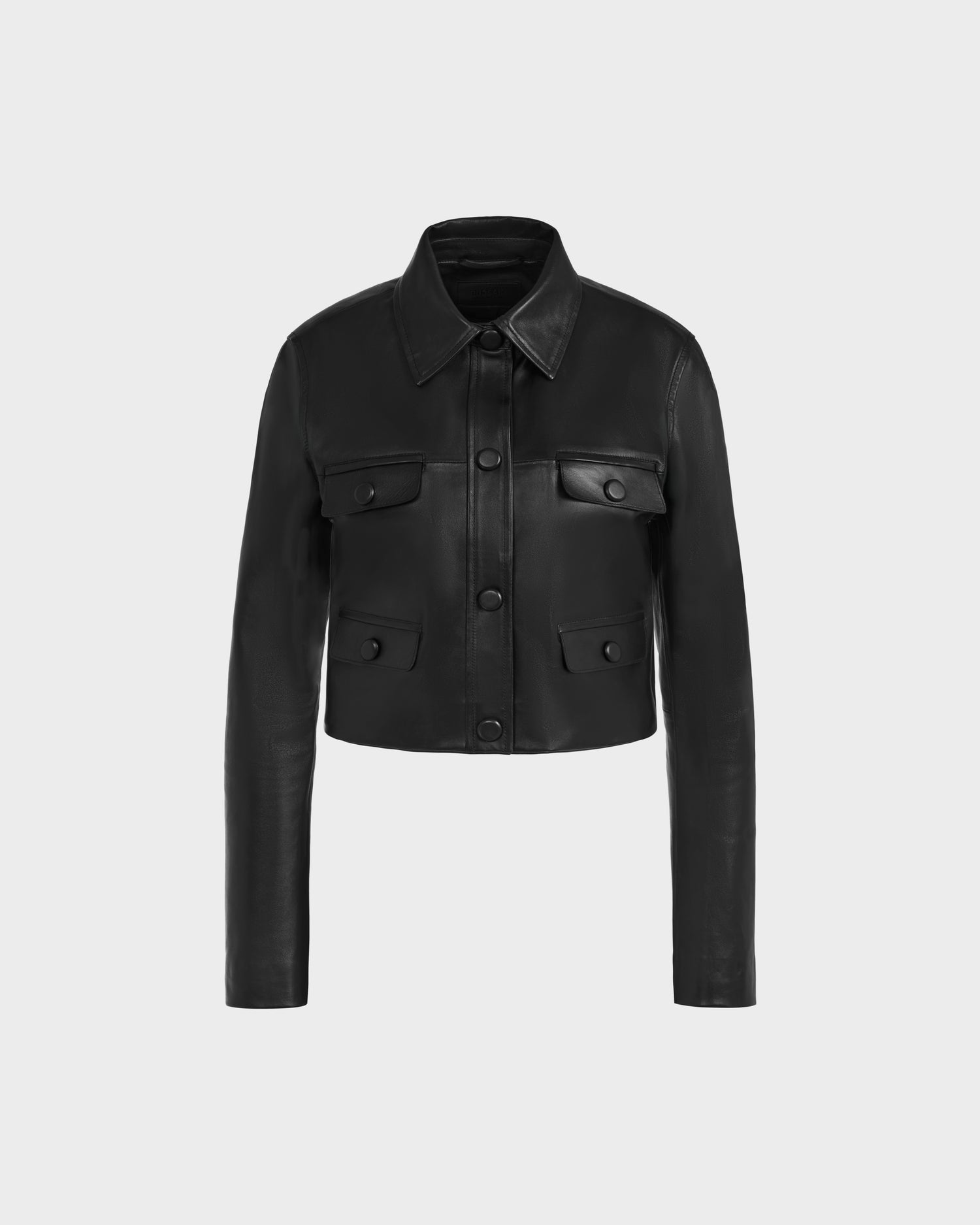 The DAVIS - 8125001 Black by Rudsak is a women’s cropped leather jacket with a collar, long sleeves, front button closure, and four flap pockets—shown on a plain light gray background, it’s perfect for any modern wardrobe.