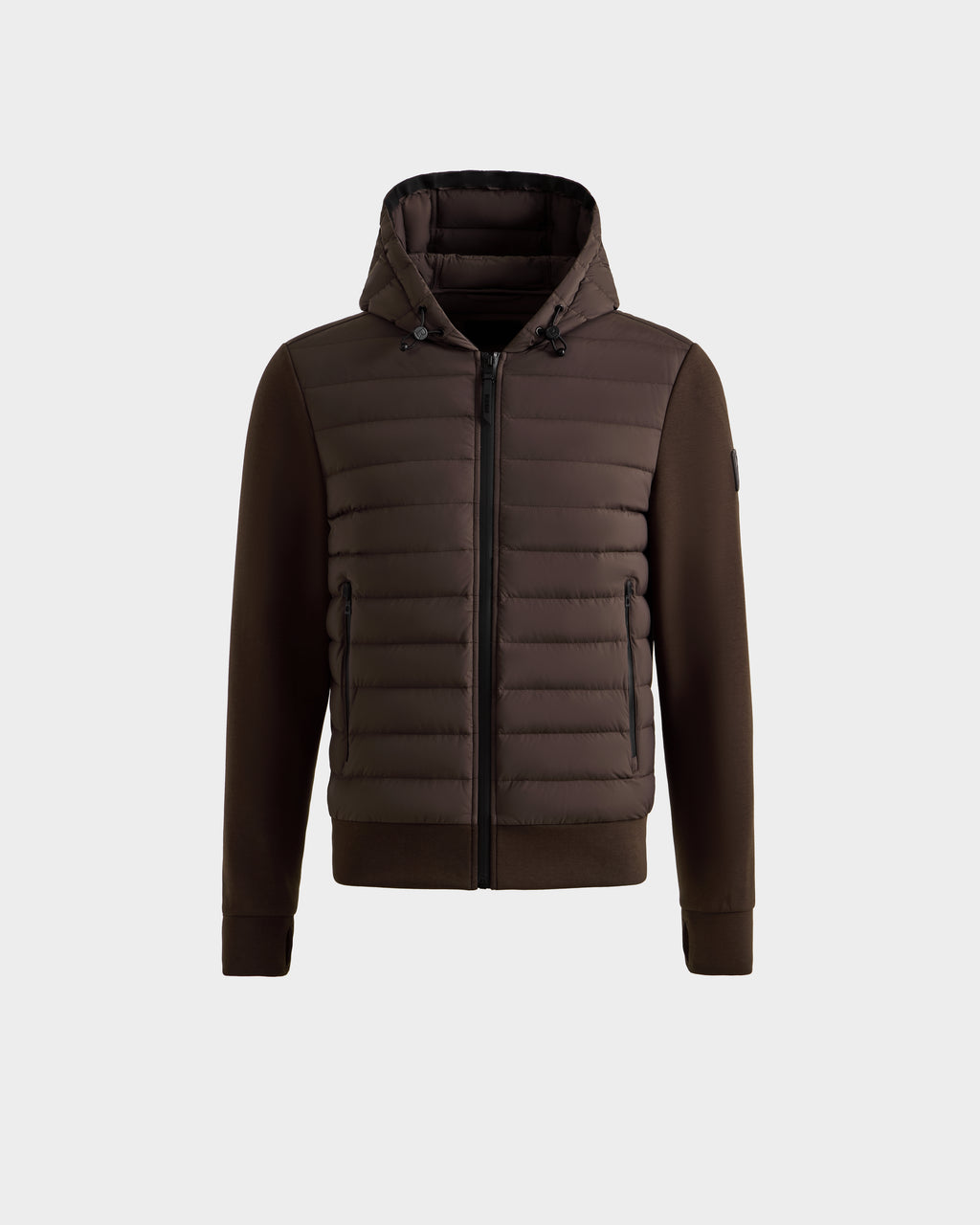 The DEE MAT - 6124028 Espresso by Rudsak is a men's lightweight hybrid down jacket featuring a quilted front, zip closure, and side pockets. Smooth sleeves and sides contrast with the puffy front for a modern urban look on a light gray background.
