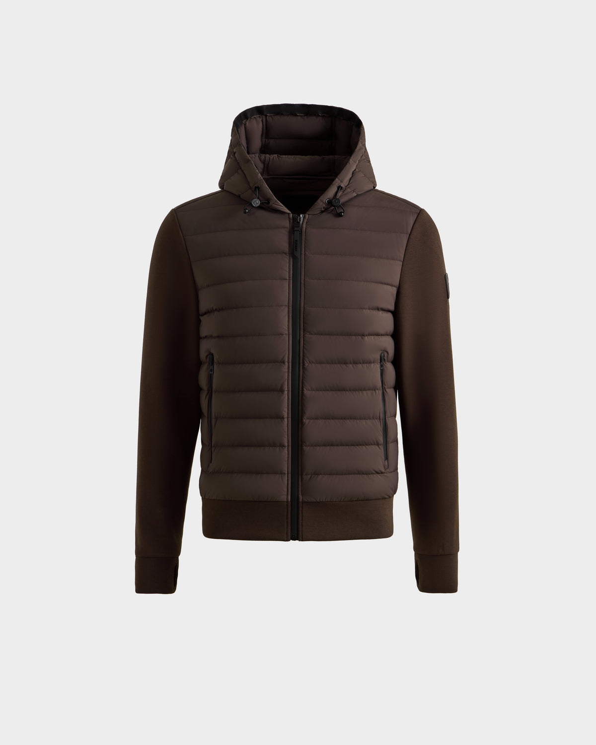 The DEE MAT - 6124028 Espresso by Rudsak is a men's lightweight hybrid down jacket featuring a quilted front, zip closure, and side pockets. Smooth sleeves and sides contrast with the puffy front for a modern urban look on a light gray background.