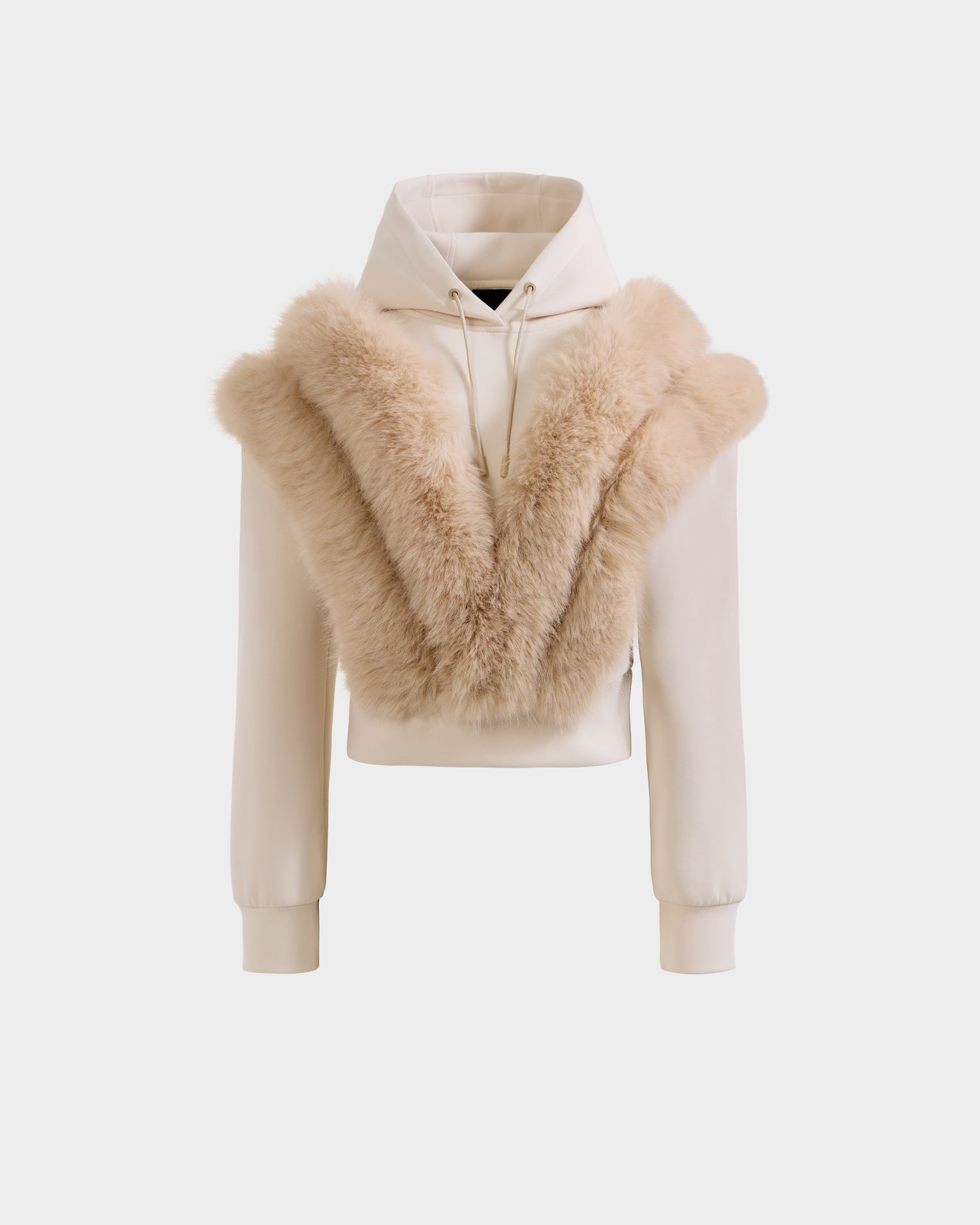 The Rudsak DELLA - 8525668 Vanilla is a cream women’s cropped hoodie with long sleeves and a V-shaped beige faux fur panel, offering cozy après-ski style.