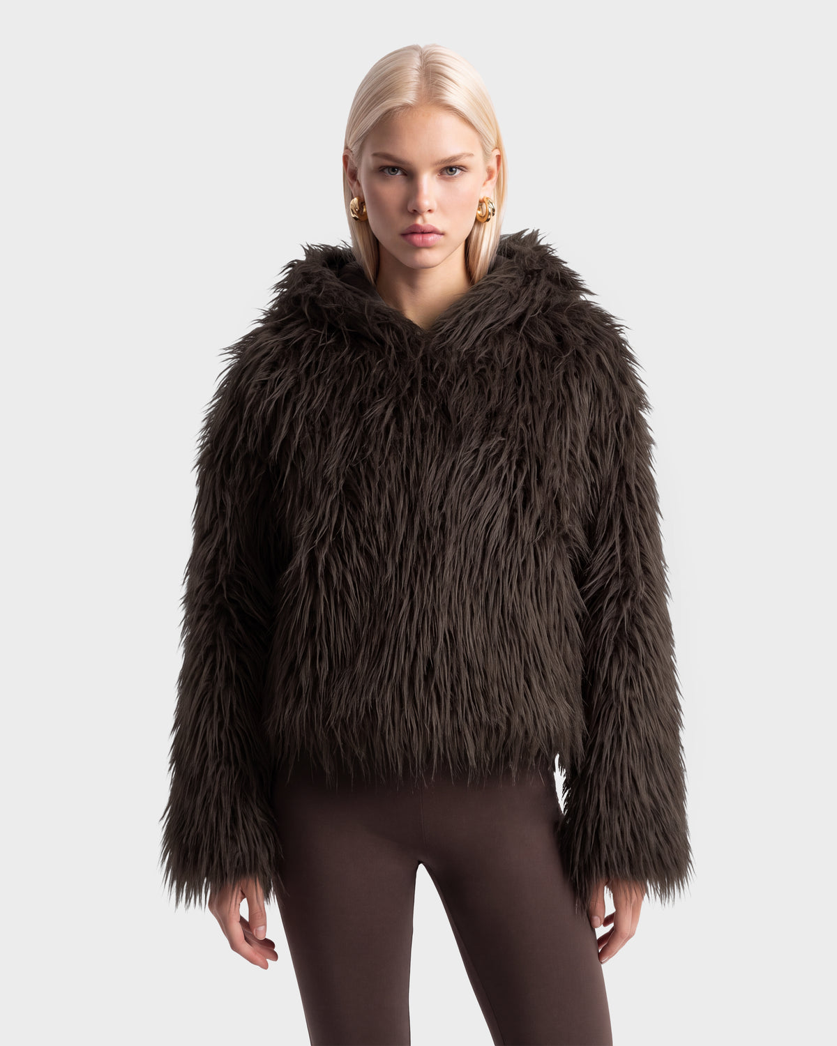 Model wearing the ELLISON - 8525678 Espresso dark brown plush faux fur hoodie with long sleeves and an oversized hood.