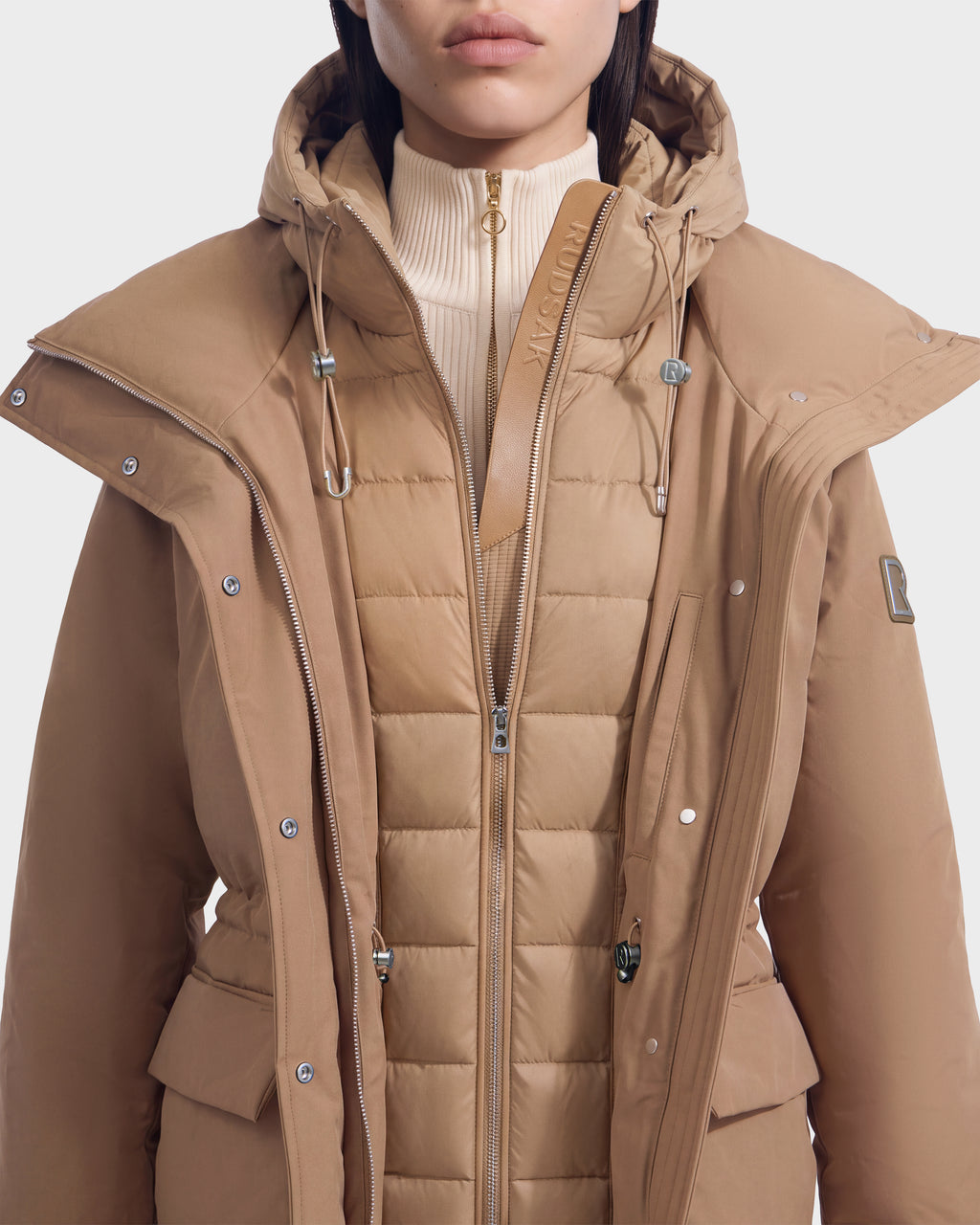 BHIMA - 8126515 Camel hooded winter coat worn over a quilted zip-up liner.