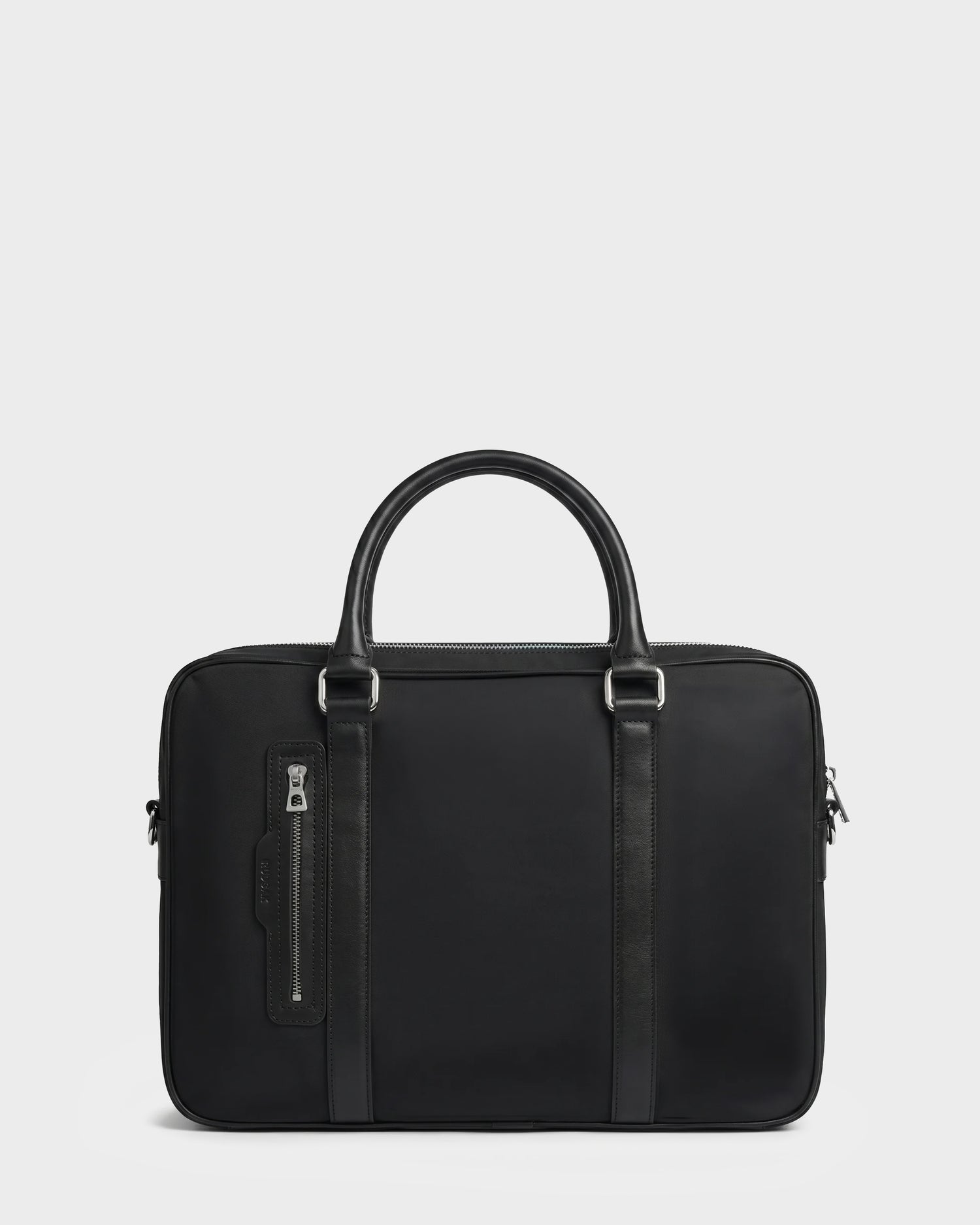 The Rudsak HENRY N - 9326056 Black is a sleek black laptop bag featuring two handles, a zipper closure, and a front zipper pocket, displayed against a plain white background.