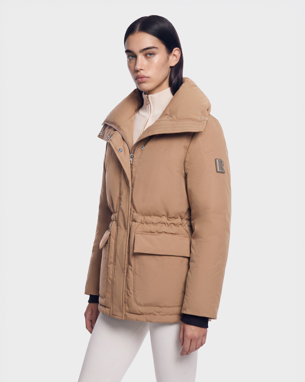 BHIMA - 8126515 Camel puffer jacket with a wide collar, drawstring waist, and two large front pockets.