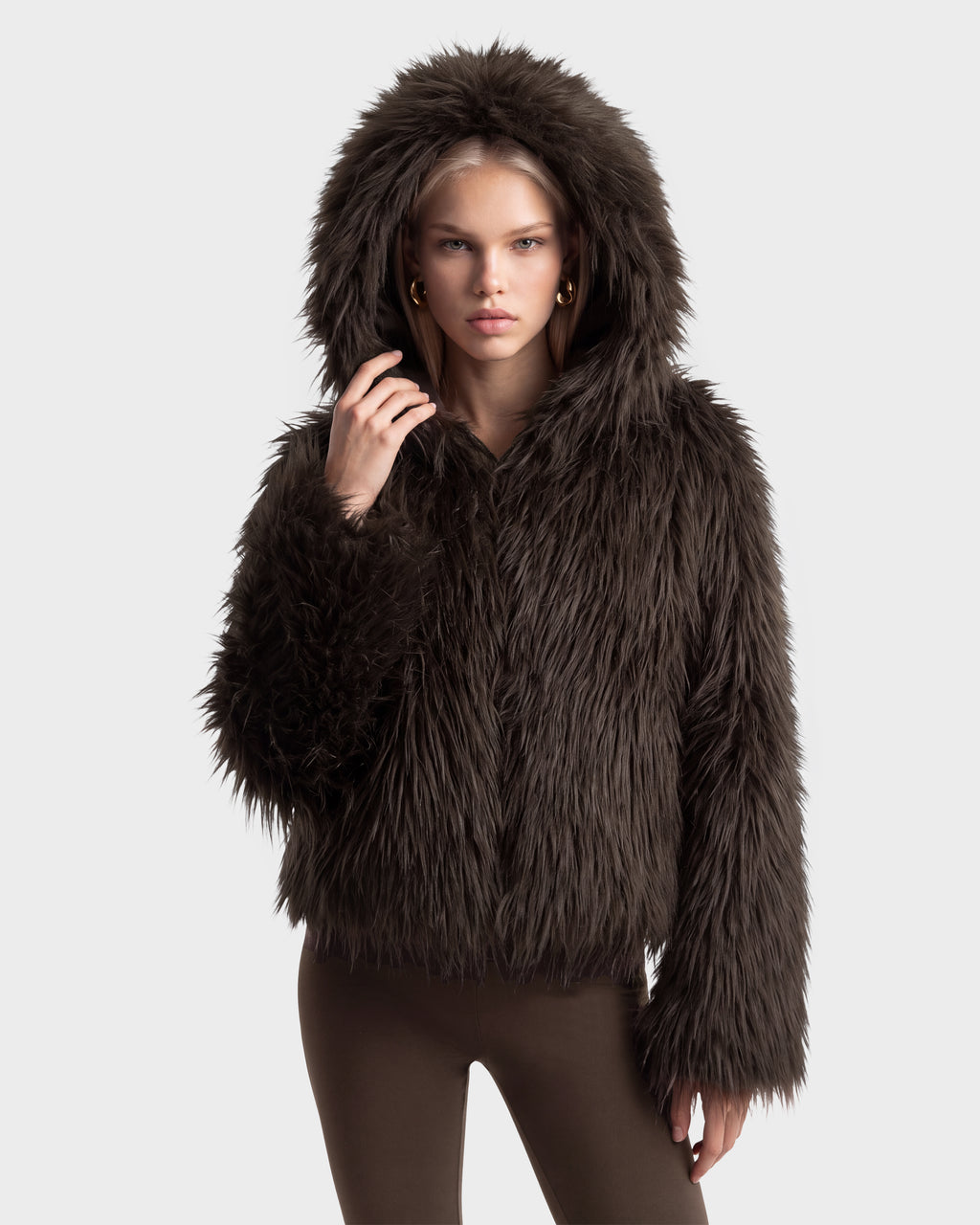 A person wearing an oversized hood on an espresso-colored ELLISON - 8525678 dark brown plush faux fur jacket.