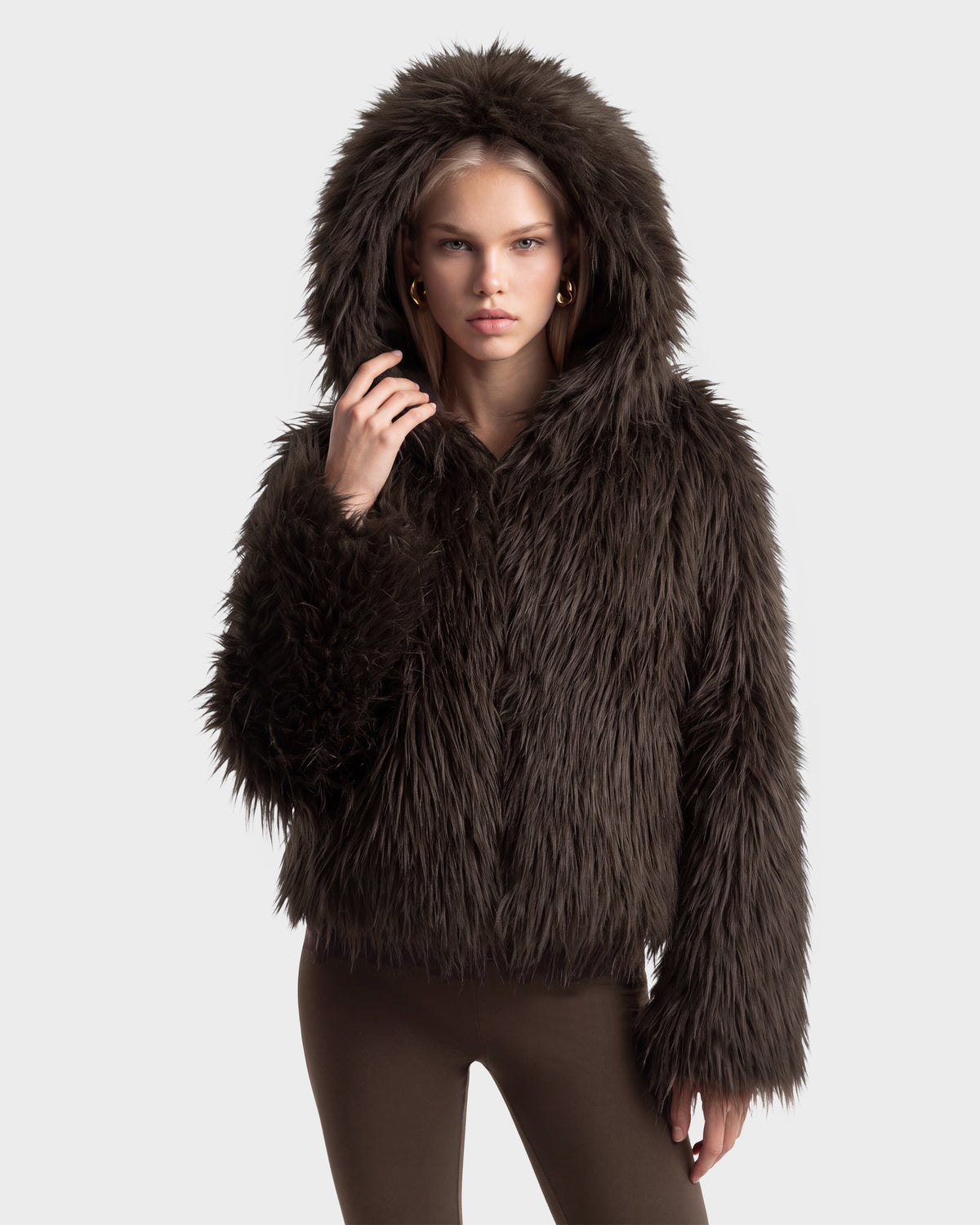 A person wearing an oversized hood on an espresso-colored ELLISON - 8525678 dark brown plush faux fur jacket.