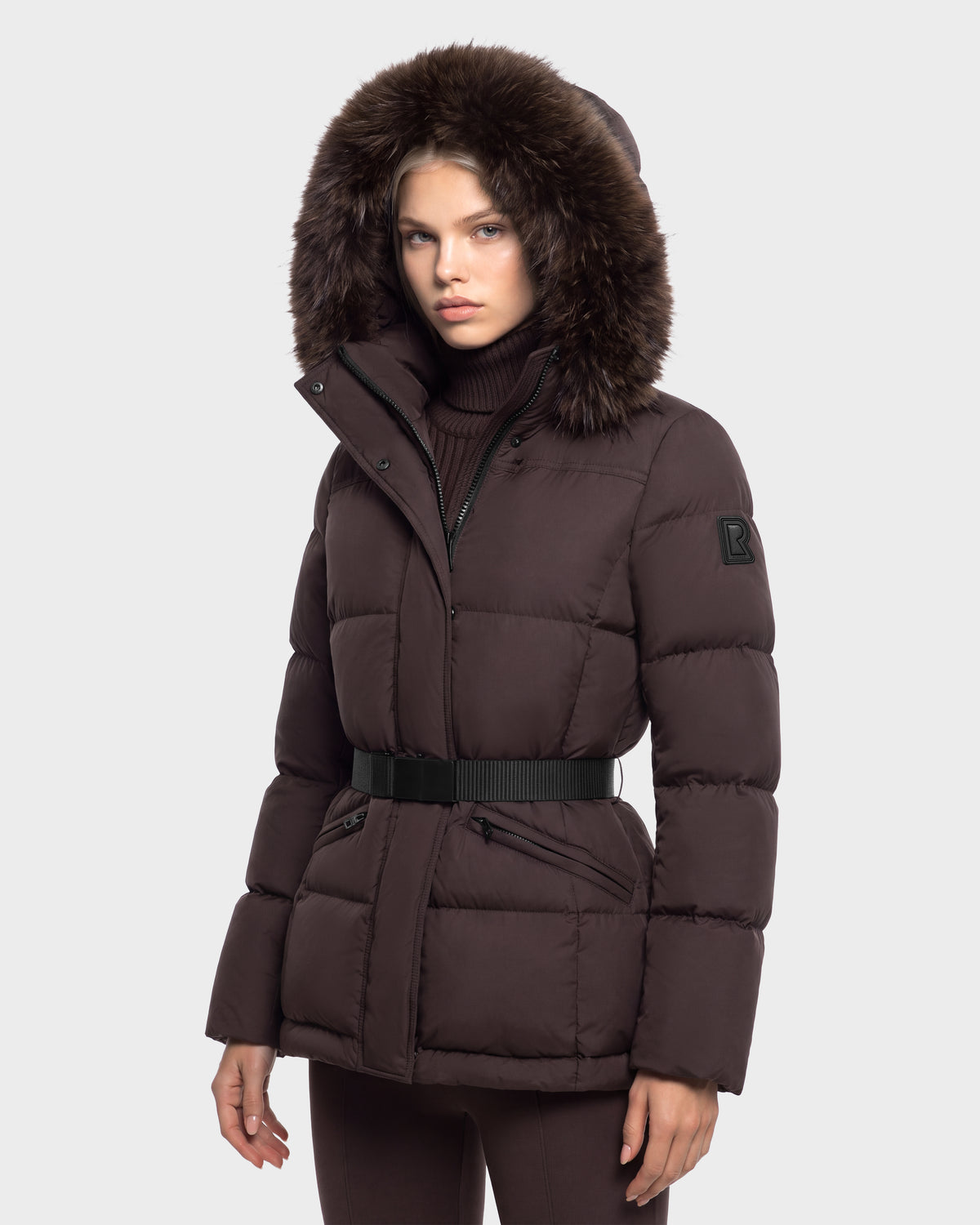 Rudsak GRACE FF - 8126535 Espresso dark brown hooded puffer jacket with a black waist belt and fur-trimmed hood.