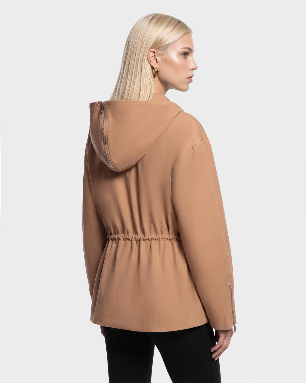 Rudsak ROSALINDA - 8126523 Camel hooded jacket with a cinched drawstring waist and zippered sleeve cuffs.