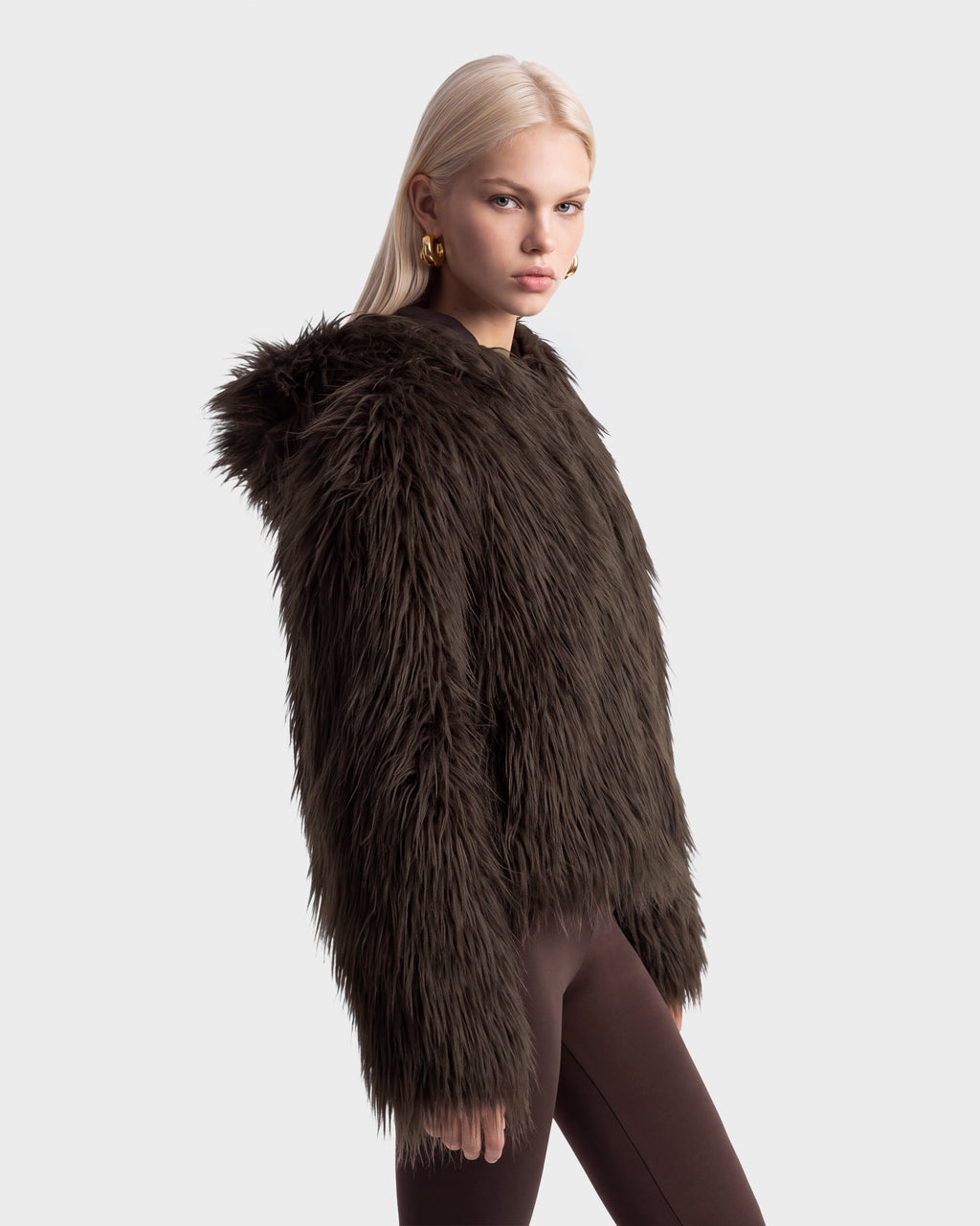 Model wearing an ELLISON - 8525678 Espresso dark brown plush faux-fur hoodie with an oversized hood.