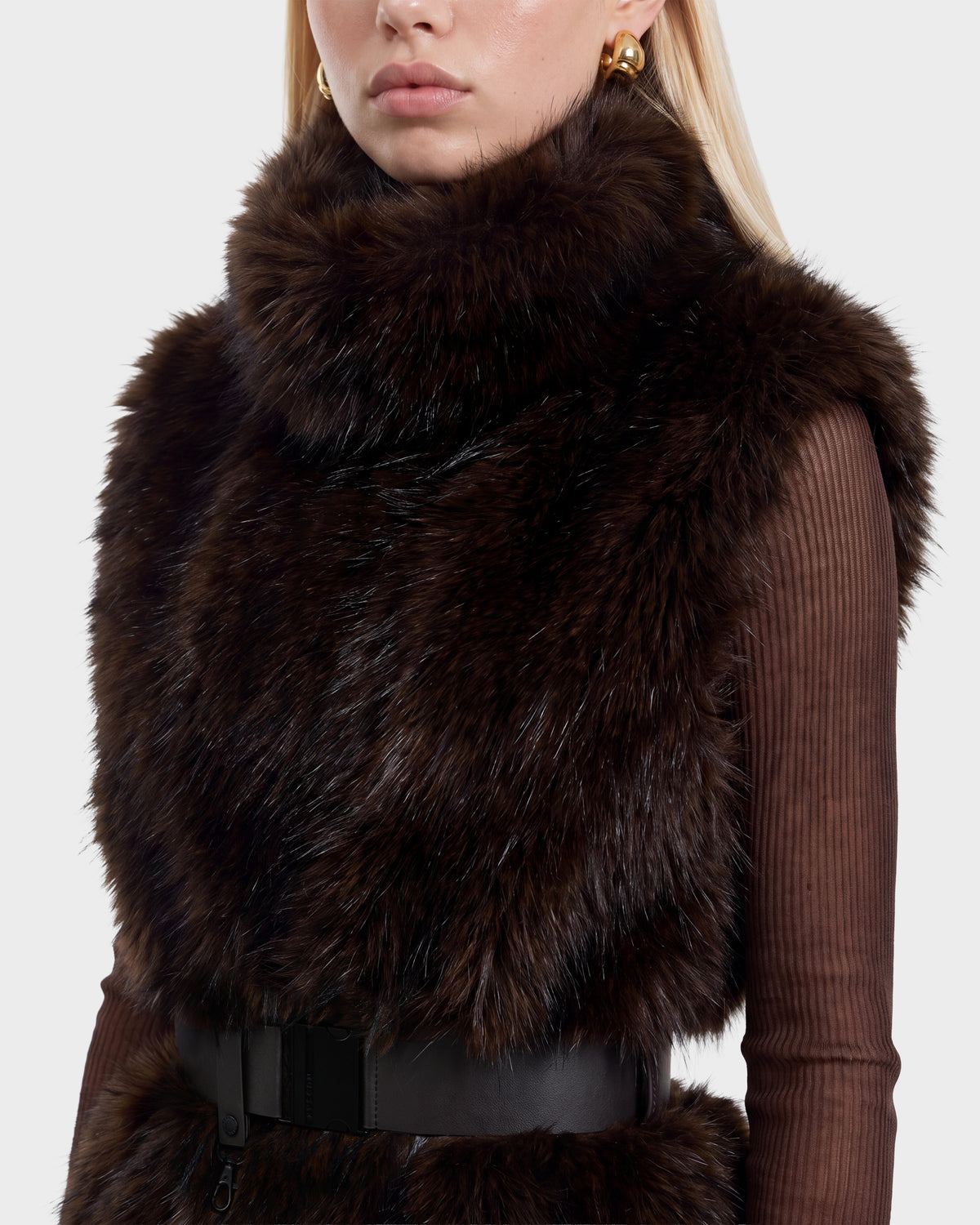 Rudsak MAULIN - 8524611 Mix Espresso dark brown faux fur vest with a high collar and a vegan leather belted waist worn over a brown ribbed long-sleeved shirt.