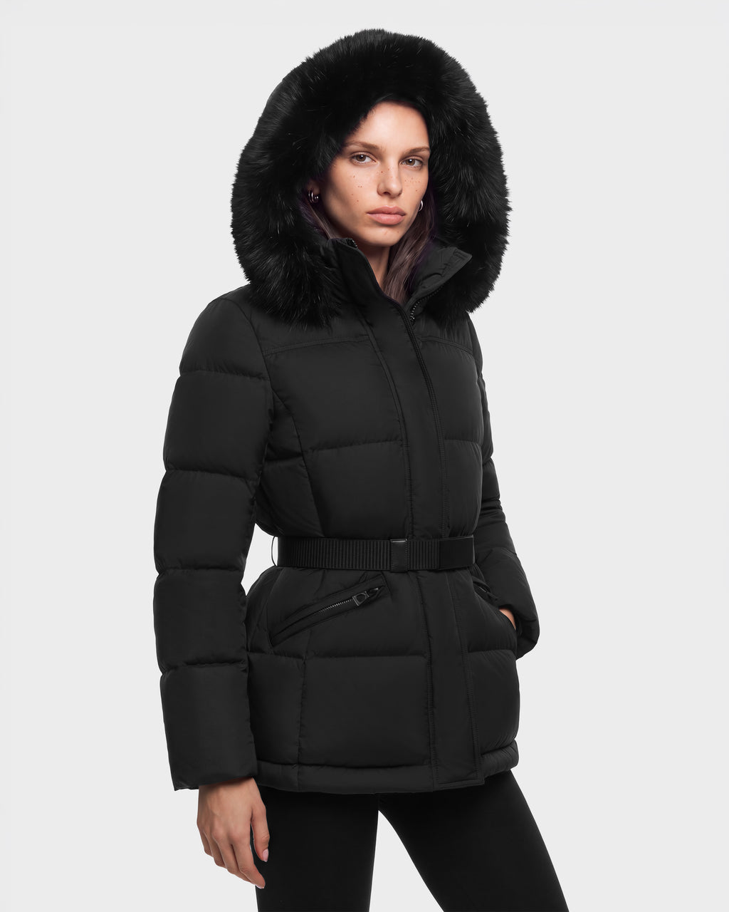 A person wears a black GRACE FF - 8126535 Black belted puffer jacket with a fur-trimmed hood.