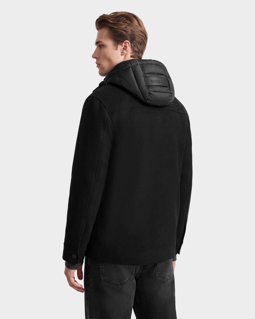 A person wearing a BRUNO - 6126716 Charcoal wool-blend coat with a black quilted hood.
