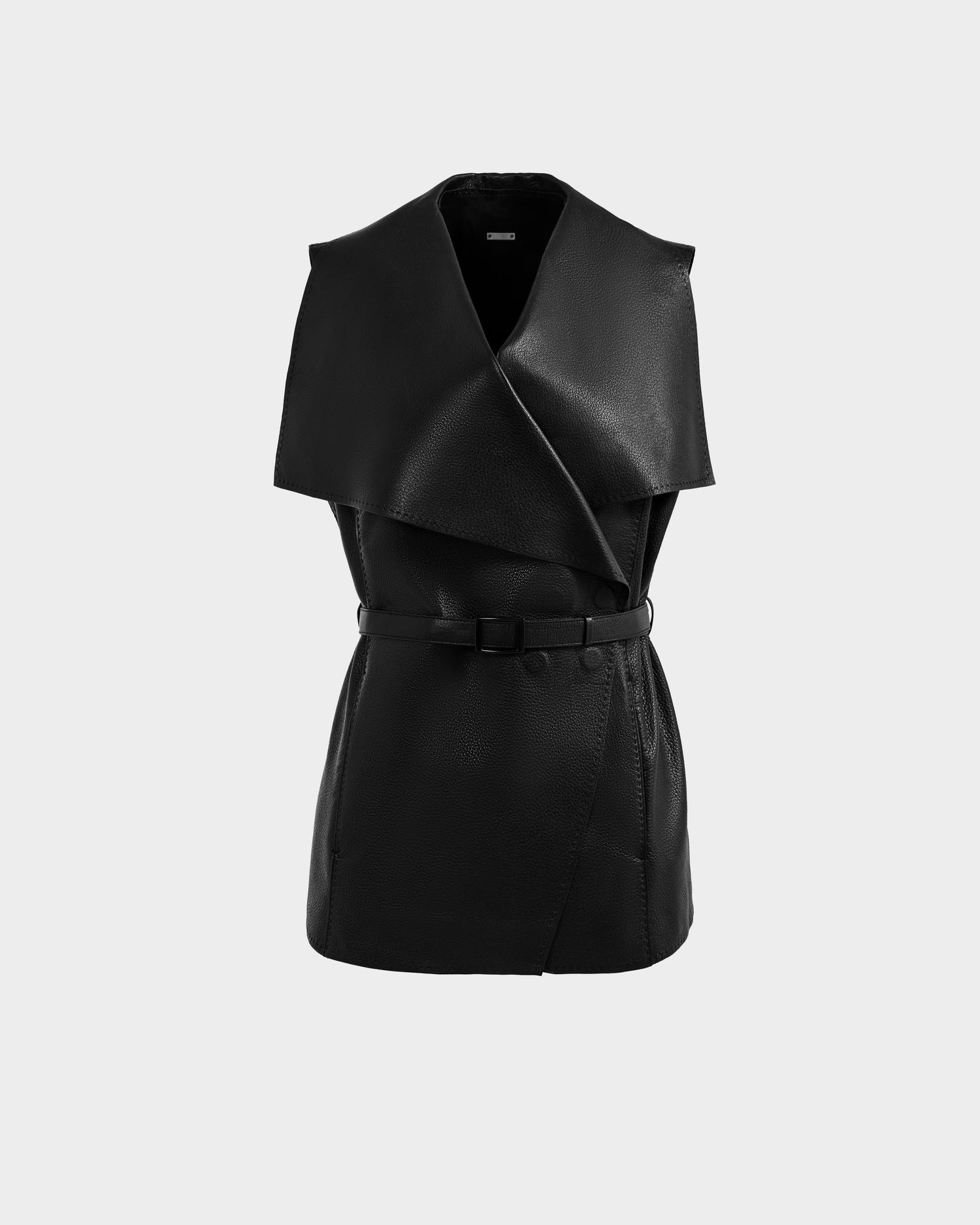 The ELEANOR - 8125584 Black by Rudsak is a women’s sleeveless leather vest in full-grain leather, with a wide shawl collar and belted waist, shown against a plain light grey background.