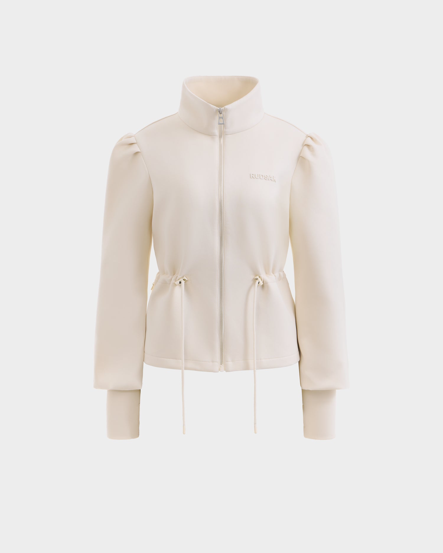 The Rudsak ELODIE - 8526039 Iceland is a cream long-sleeve zip-up sweater jacket with a high collar, slight puffed shoulders, adjustable waist drawstrings, and ribbed cuffs, made from stretch cotton blend and shown on a plain white background.