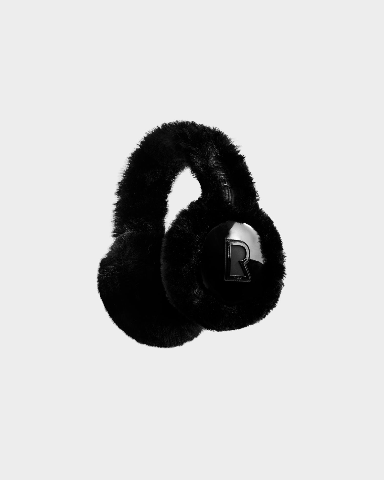 The Rudsak VALENCIA - 8425543 Black faux fur earmuffs feature a shiny black "R" logo on one ear cover and are shown against a plain light gray background, making them the perfect winter accessory.
