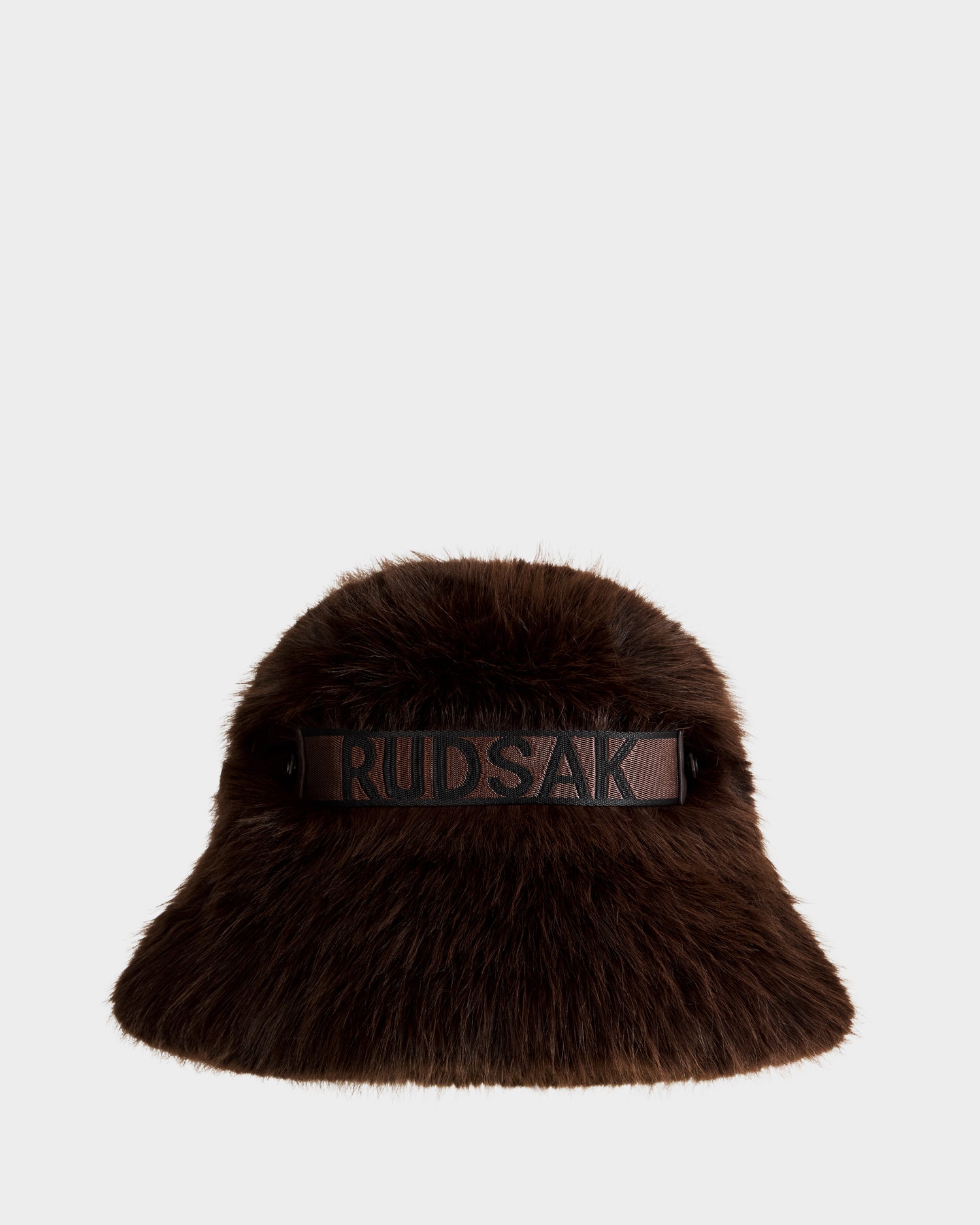 The ROMINA - 8425545 Espresso by Rudsak is a brown faux fur bucket hat with a wide brim and black RUDSAK band, making it a bold winter accessory for women, shown here against a plain white background.
