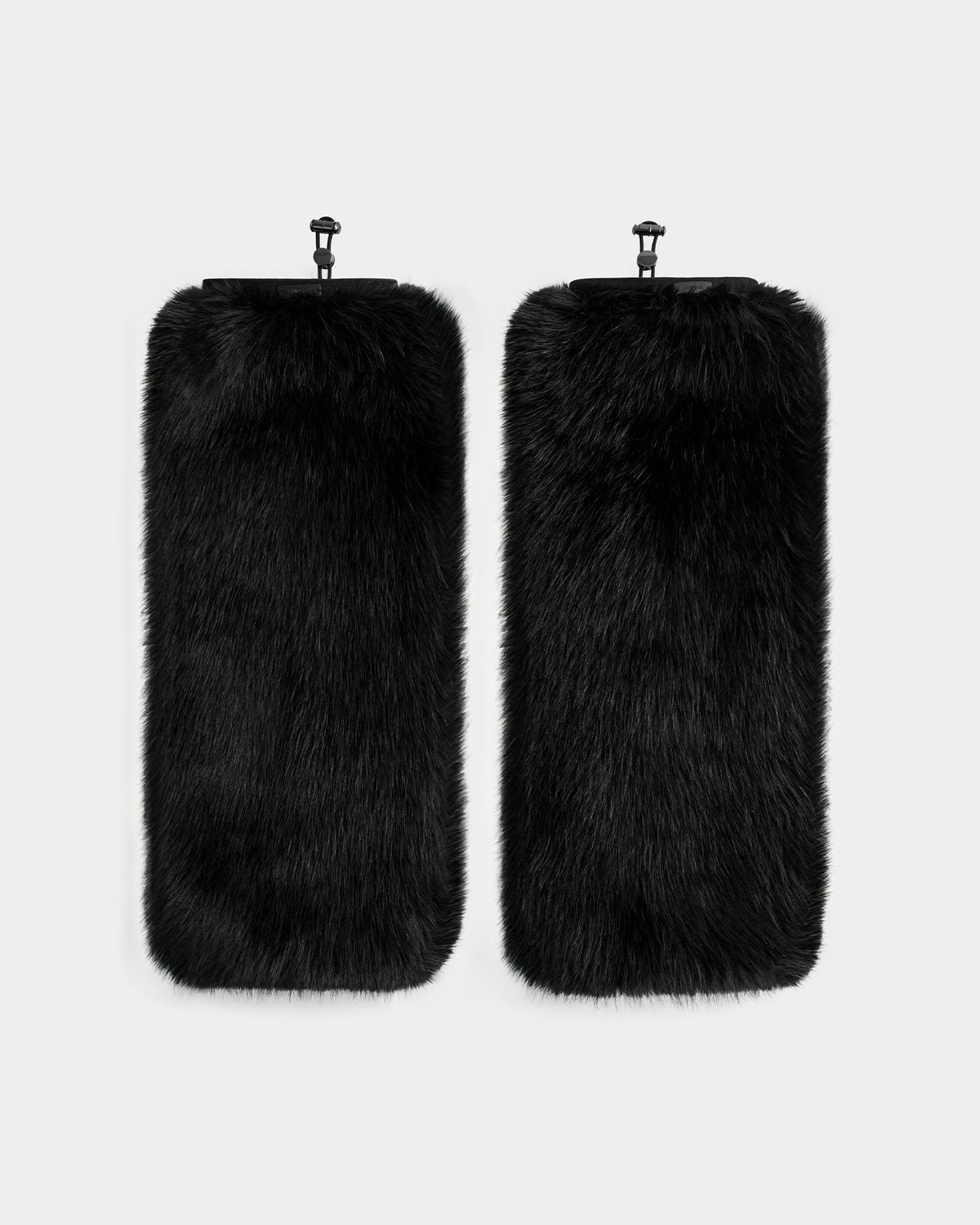 The PAIGE - 8425534 Black leg warmers by Rudsak feature rectangular black faux fur and clips at the top—an elegant women’s winter accessory, ideal for après-ski chic style. Displayed side by side on a plain light background.