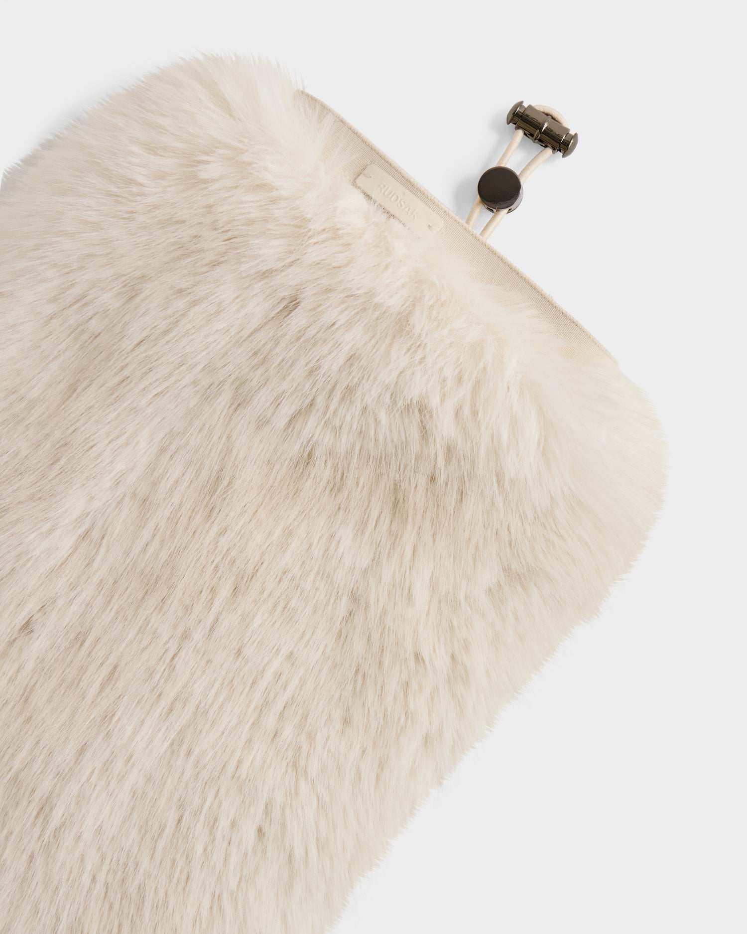 A close-up of the Rudsak PAIGE - 8425534 Vanilla clutch—a cream-colored faux fur women’s winter accessory with a metal clasp, set against a white background.