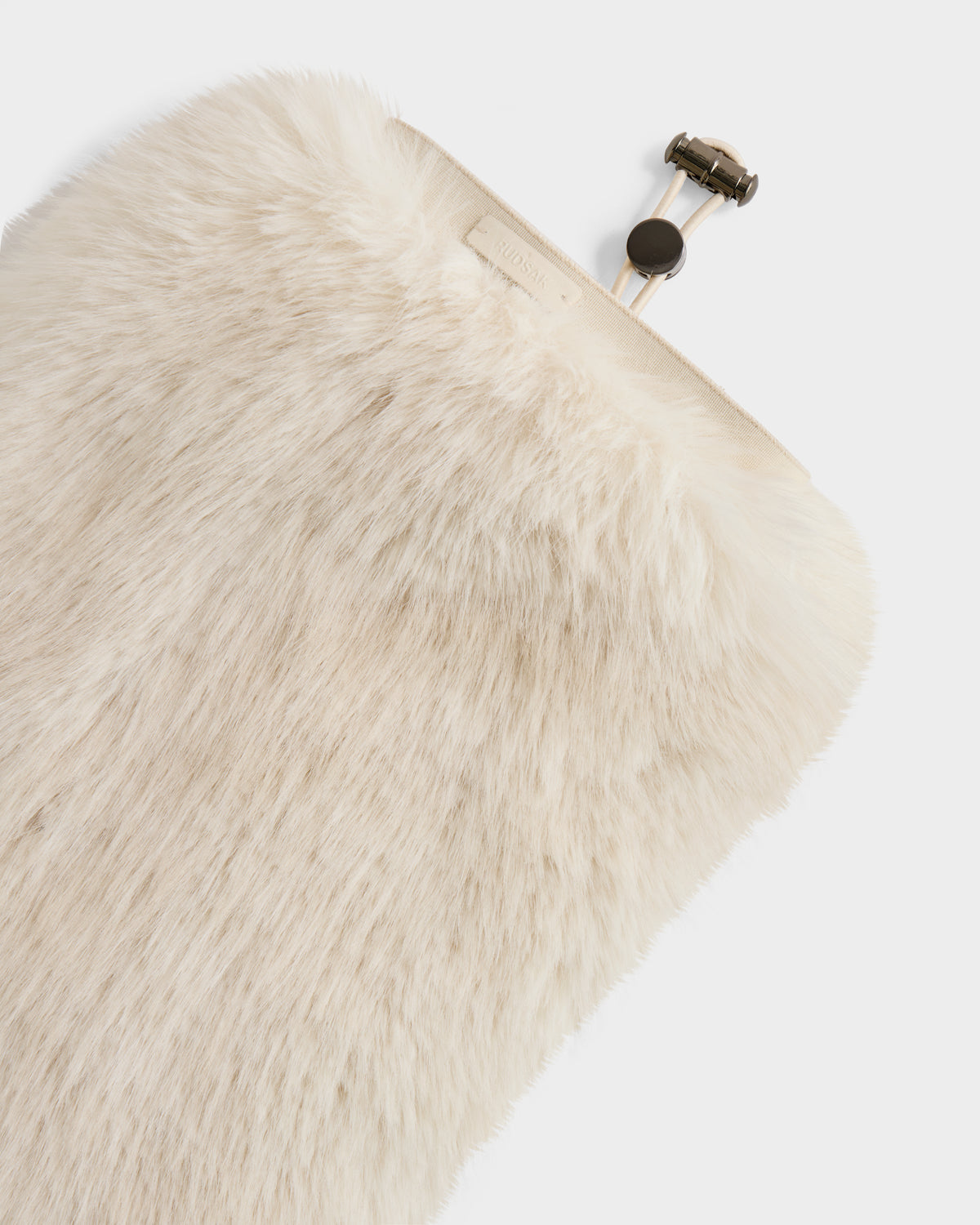 A close-up of the Rudsak PAIGE - 8425534 Vanilla clutch—a cream-colored faux fur women’s winter accessory with a metal clasp, set against a white background.