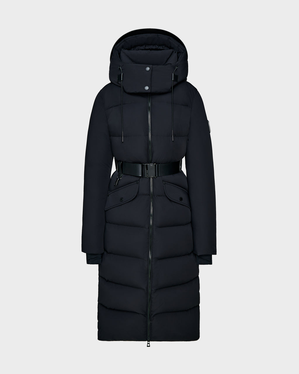 The Rudsak CALI - 8124600 Black is a womens long down puffer coat with RDS-certified down, hood, high collar, front zipper, button flap, waist belt, and two large front pockets shown against a light background.